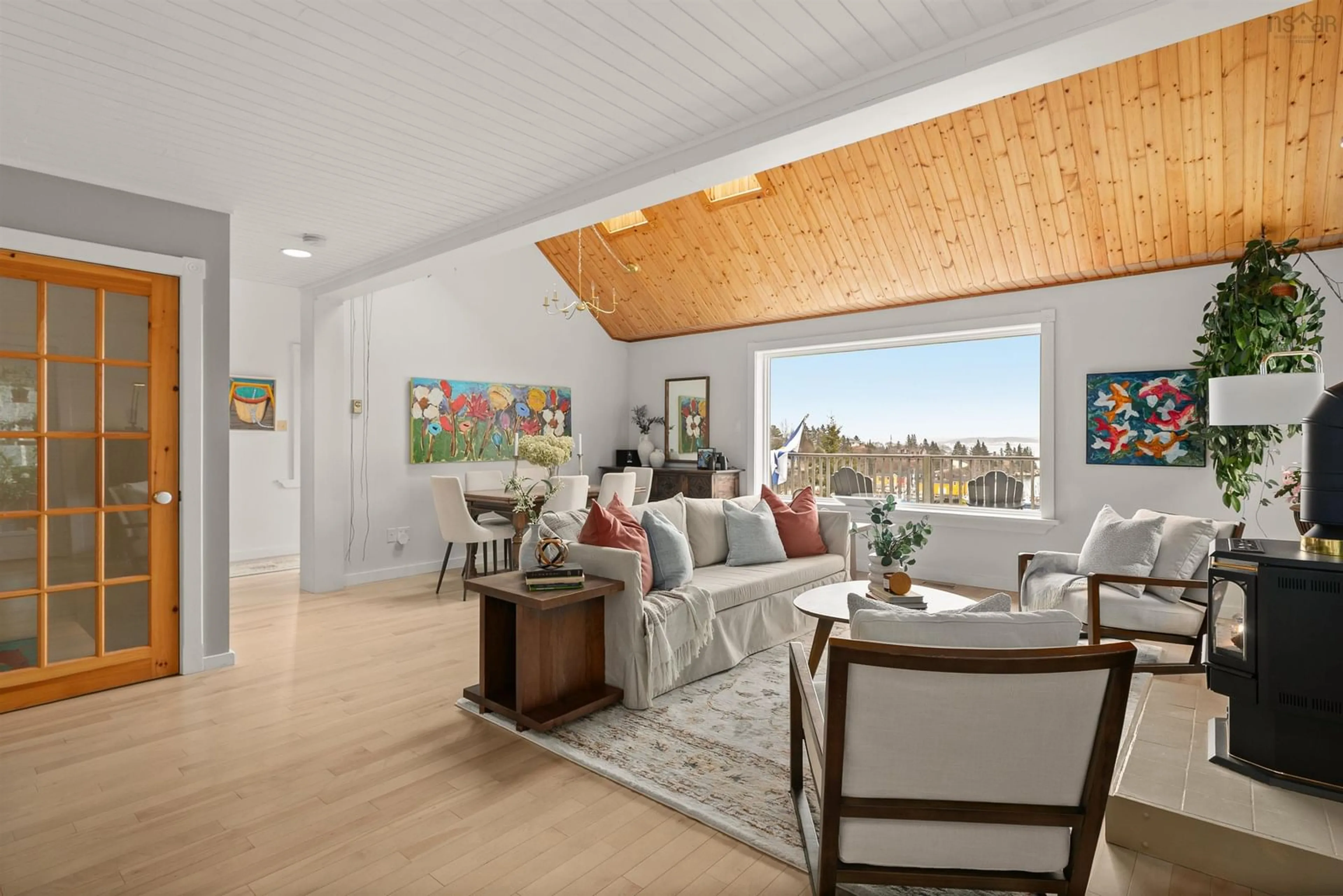 Living room with furniture, wood/laminate floor for 2654 Highway 329, Northwest Cove Nova Scotia B0J 1T0