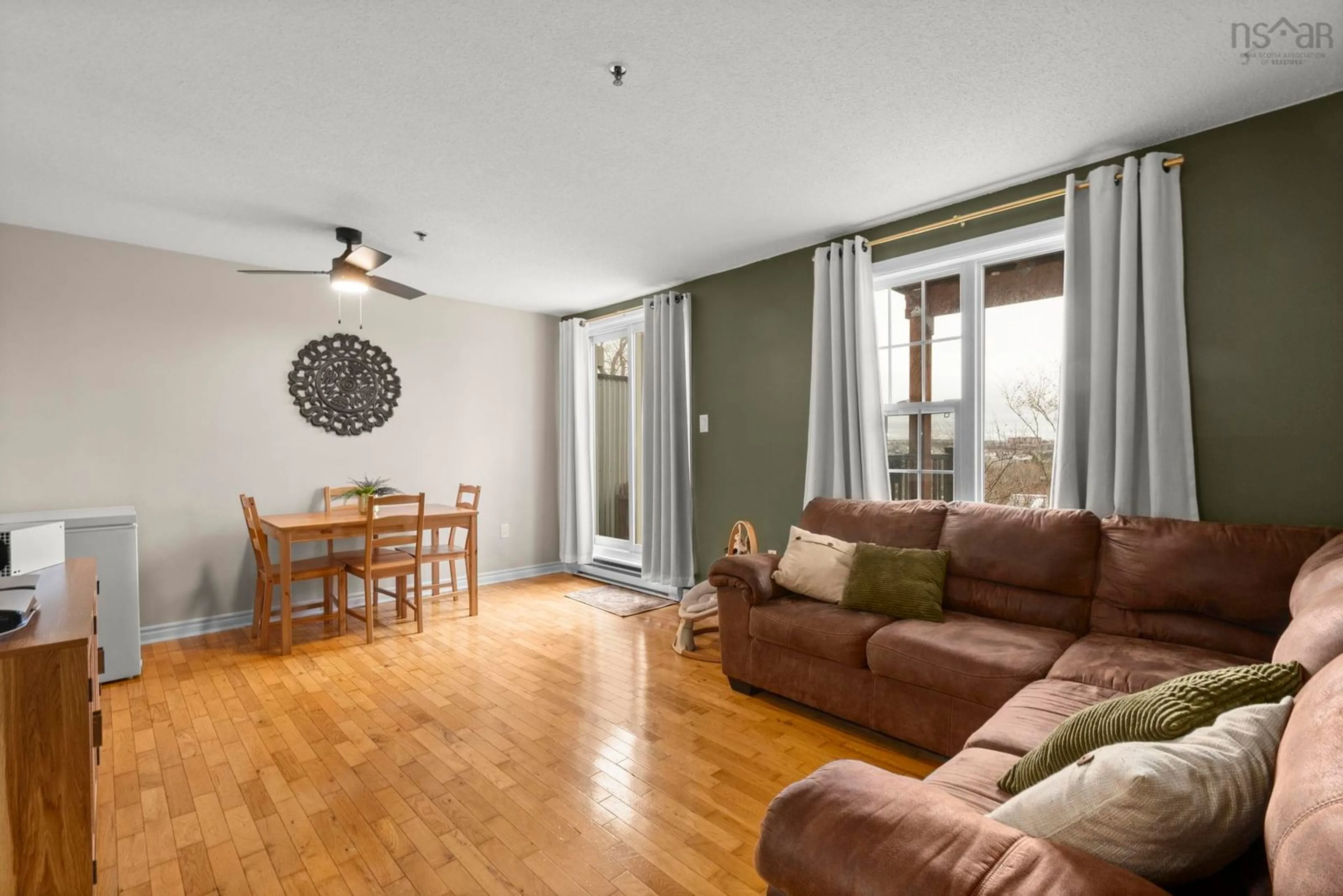 Living room with furniture, wood/laminate floor for 79 Collins Grove #115, Dartmouth Nova Scotia B2W 0B9