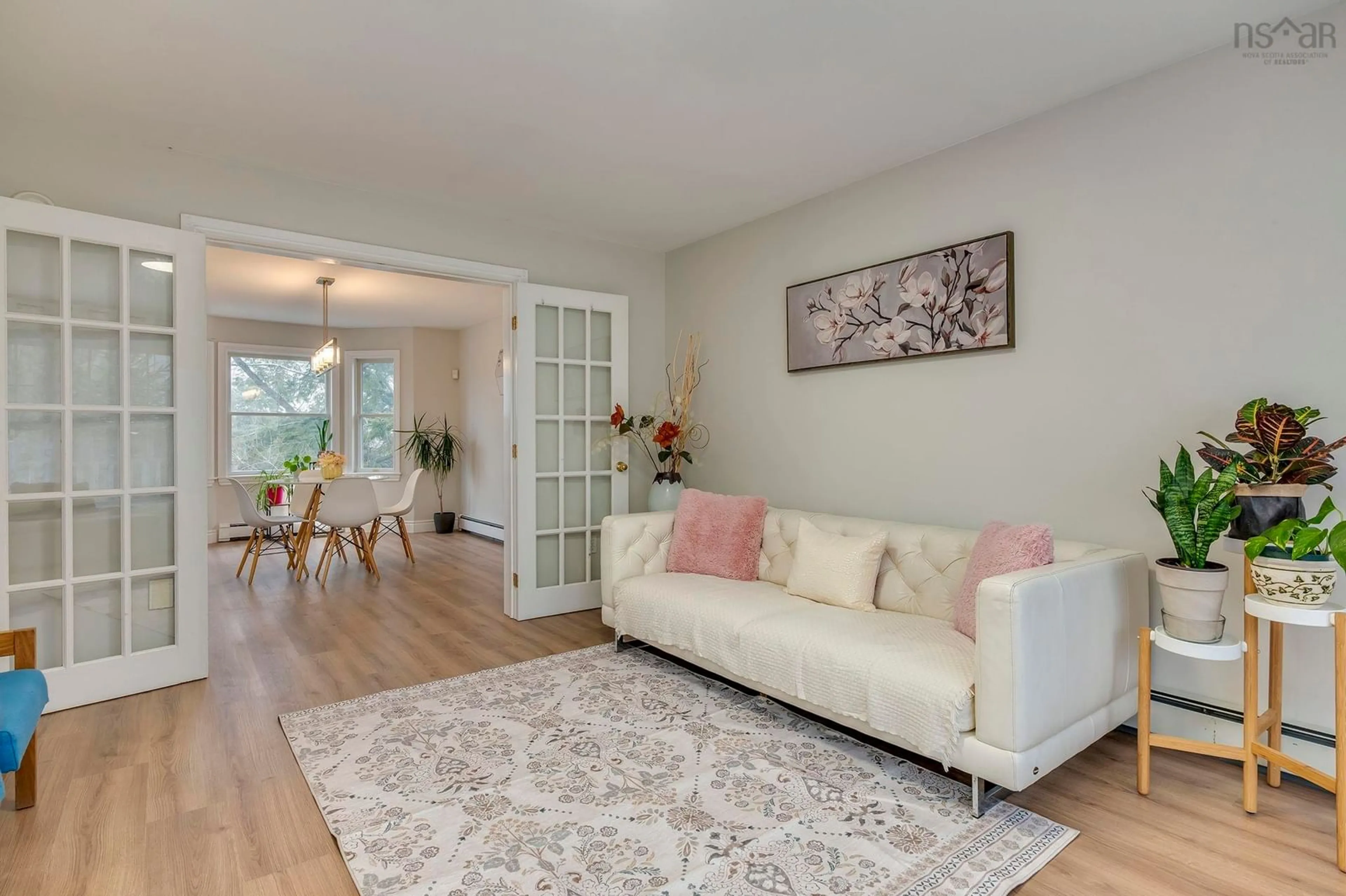 Living room with furniture, wood/laminate floor for 47 Nottingham St, Bedford Nova Scotia B4A 3A8