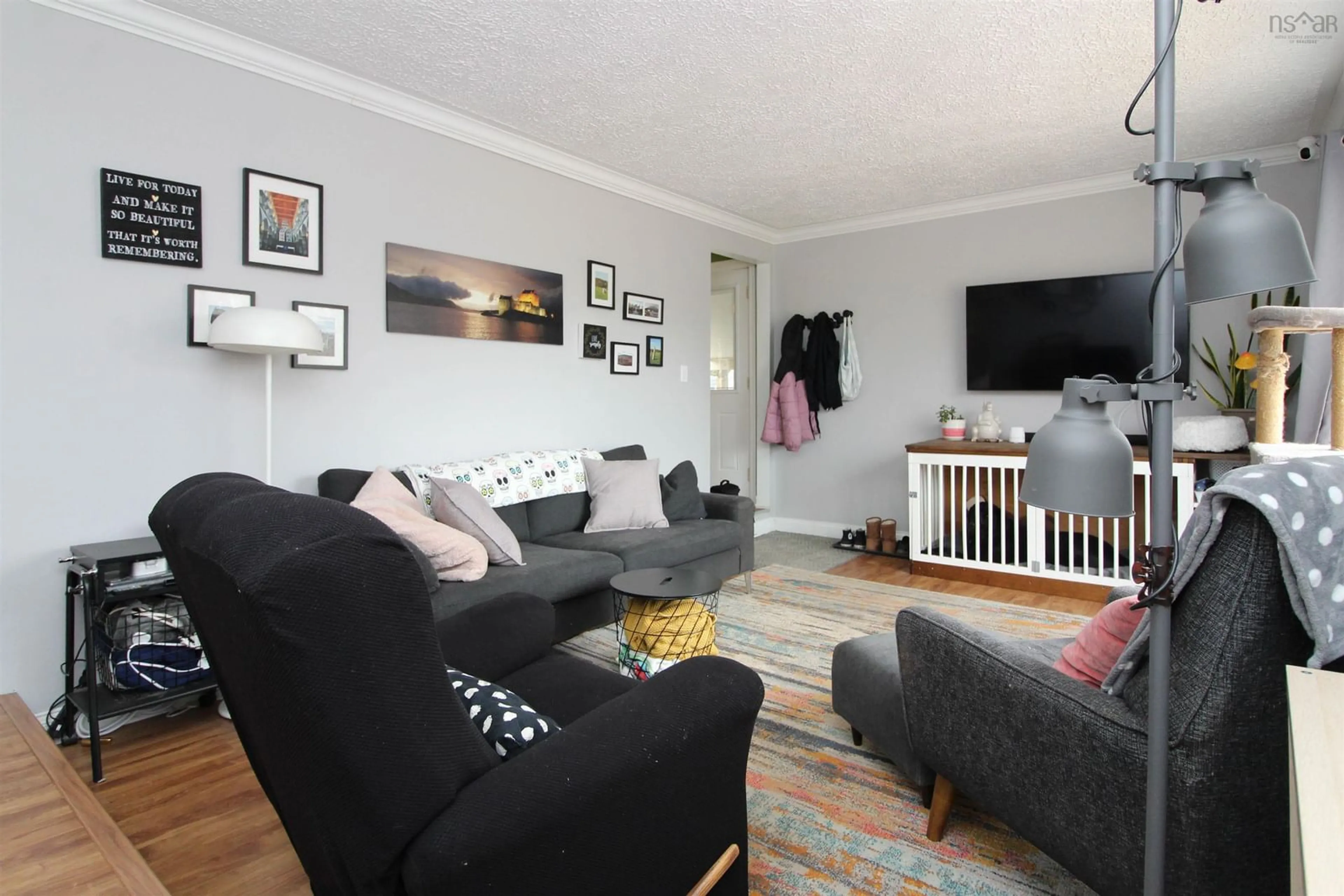 Living room with furniture, wood/laminate floor for 72 Morley Ave, Truro Heights Nova Scotia B6L 1M7