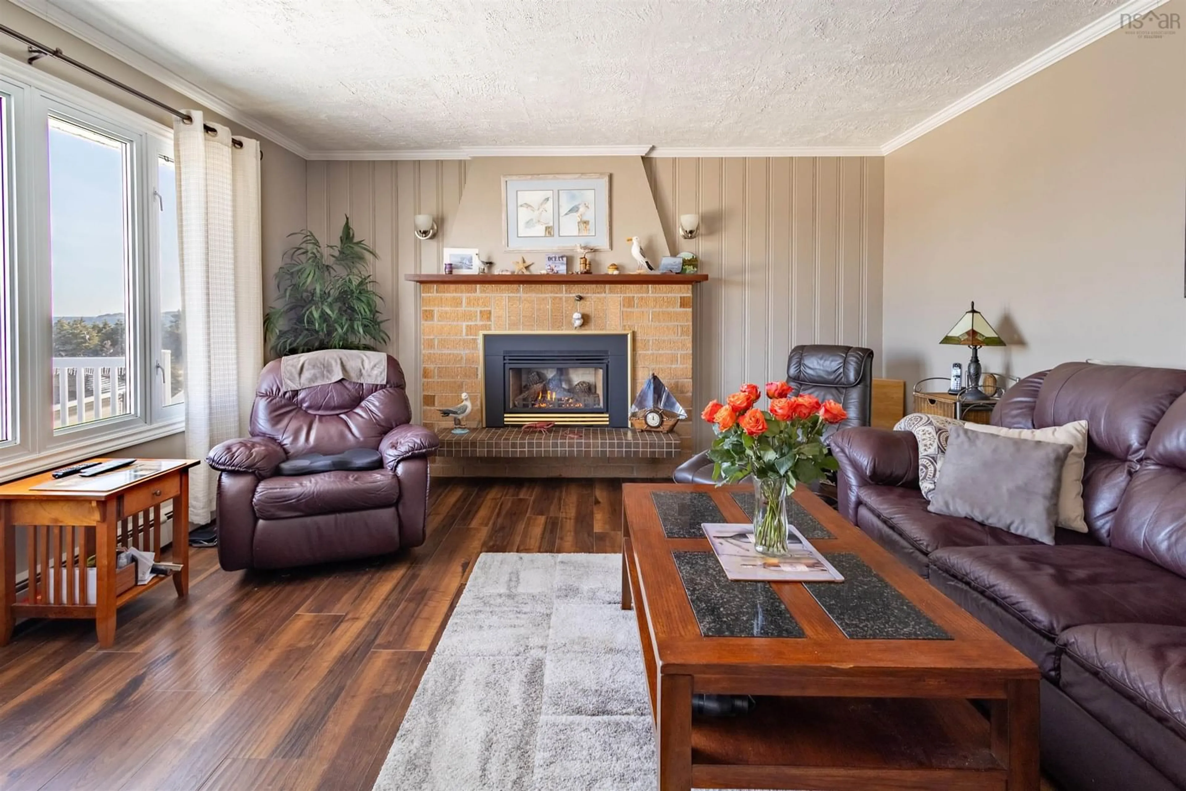Living room with furniture, wood/laminate floor for 16 Seaview Lane, Main-À-Dieu Nova Scotia B1C 1Z2