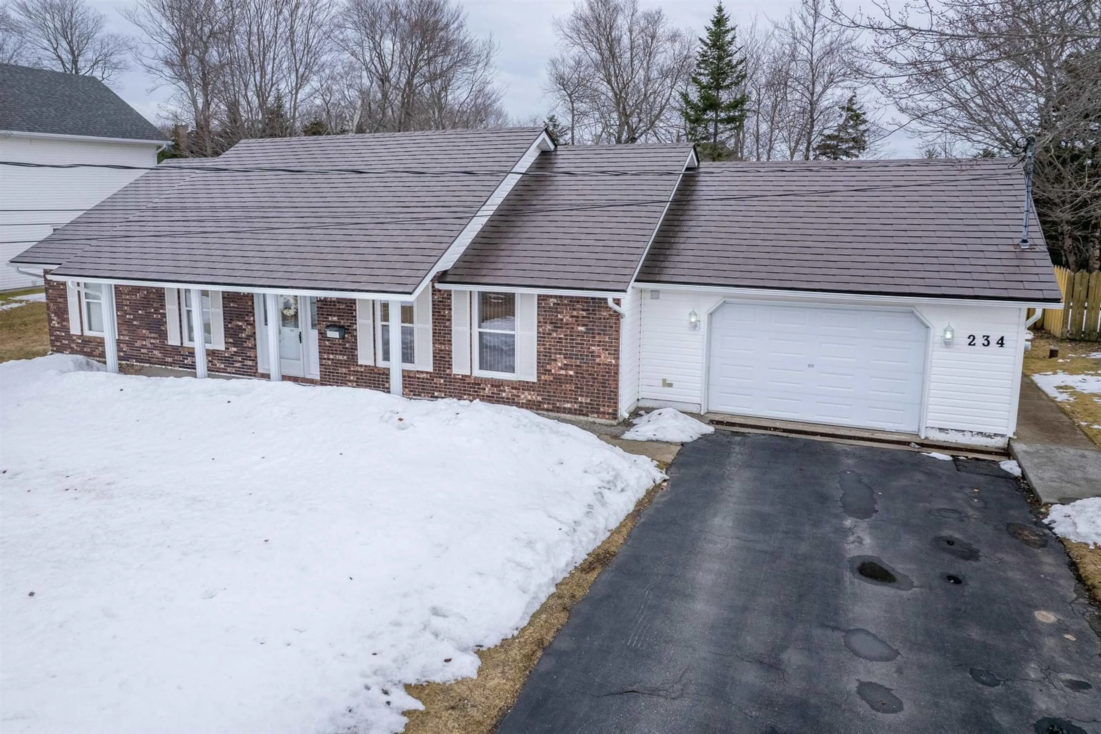 A pic from outside/outdoor area/front of a property/back of a property/a pic from drone, unknown for 234 Riverview Dr, Sydney River Nova Scotia B1S 3R7