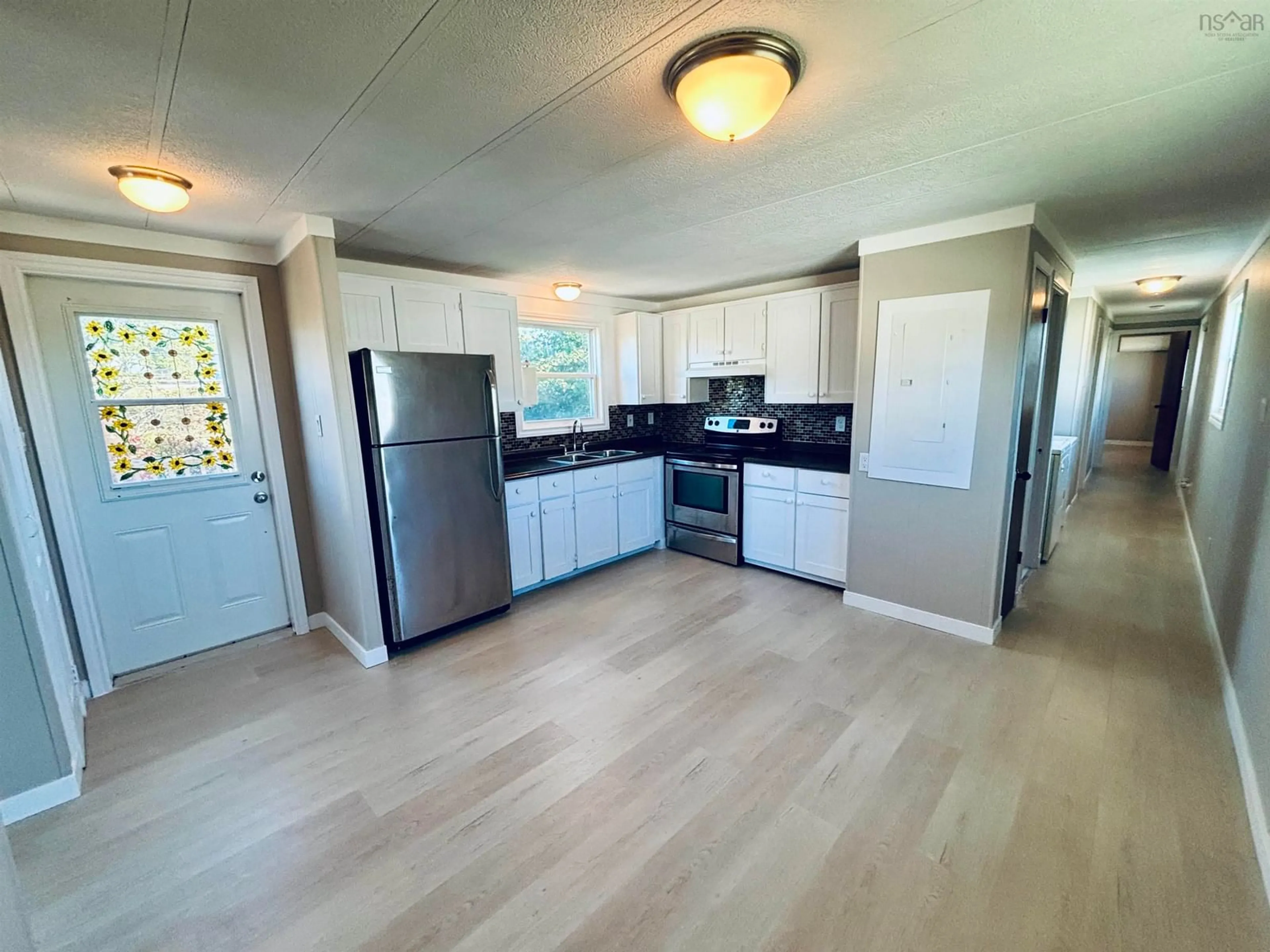 Open concept kitchen, unknown for 14 Chisholm Crt, Port Hawkesbury Nova Scotia B9A 3M2