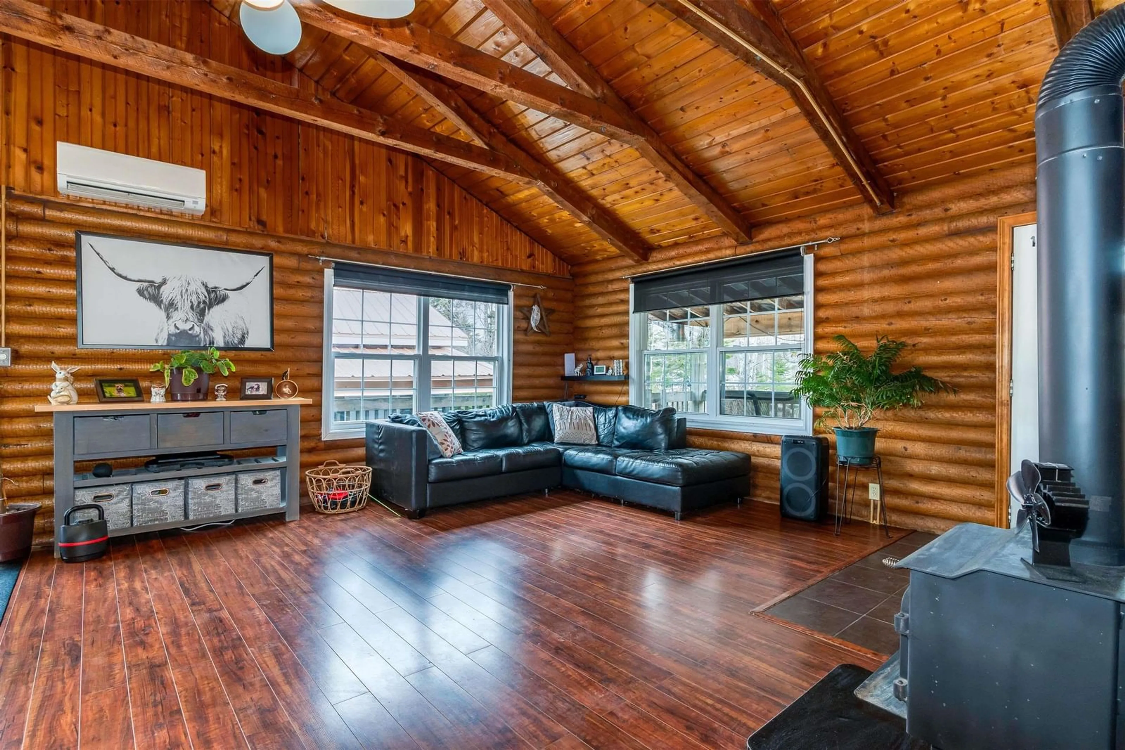 Living room with furniture, wood/laminate floor for 891 Mcmullin Rd, Antrim Nova Scotia B0N 2H0