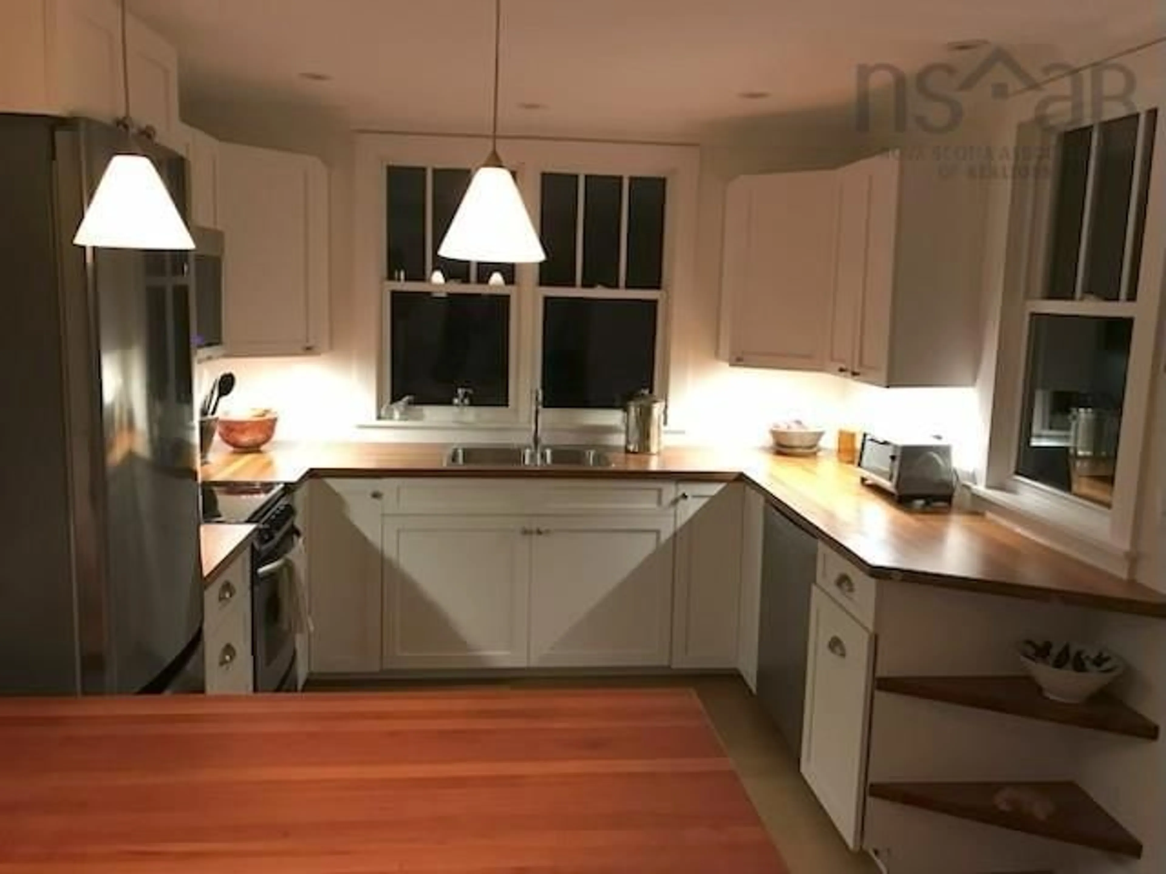 Open concept kitchen, wood/laminate floor for 2041 Clarence Rd, Clarence Nova Scotia B0S 1C0