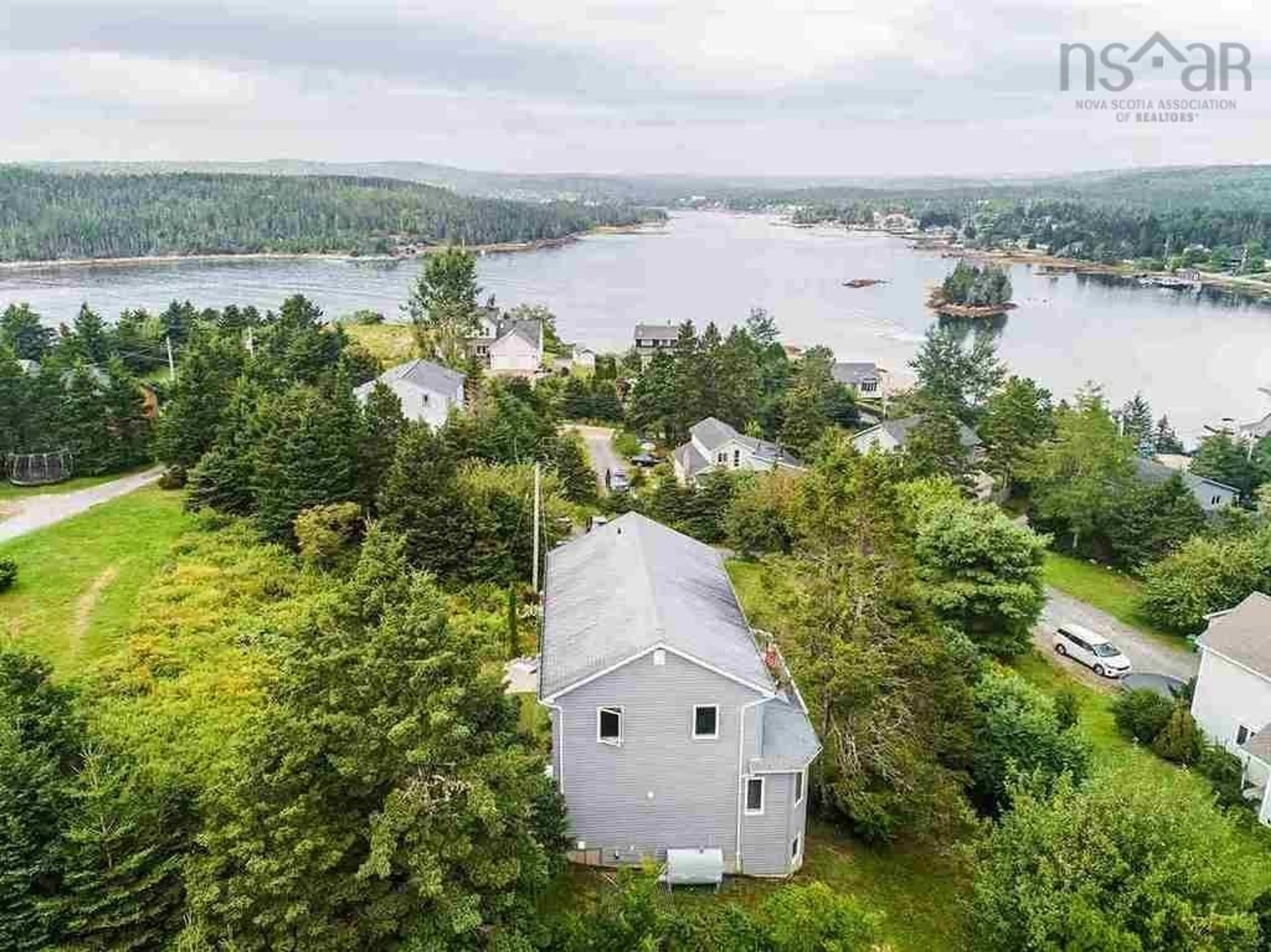 A pic from outside/outdoor area/front of a property/back of a property/a pic from drone, water/lake/river/ocean view for 52 Appletree Hill, Shad Bay Nova Scotia B3T 2B7
