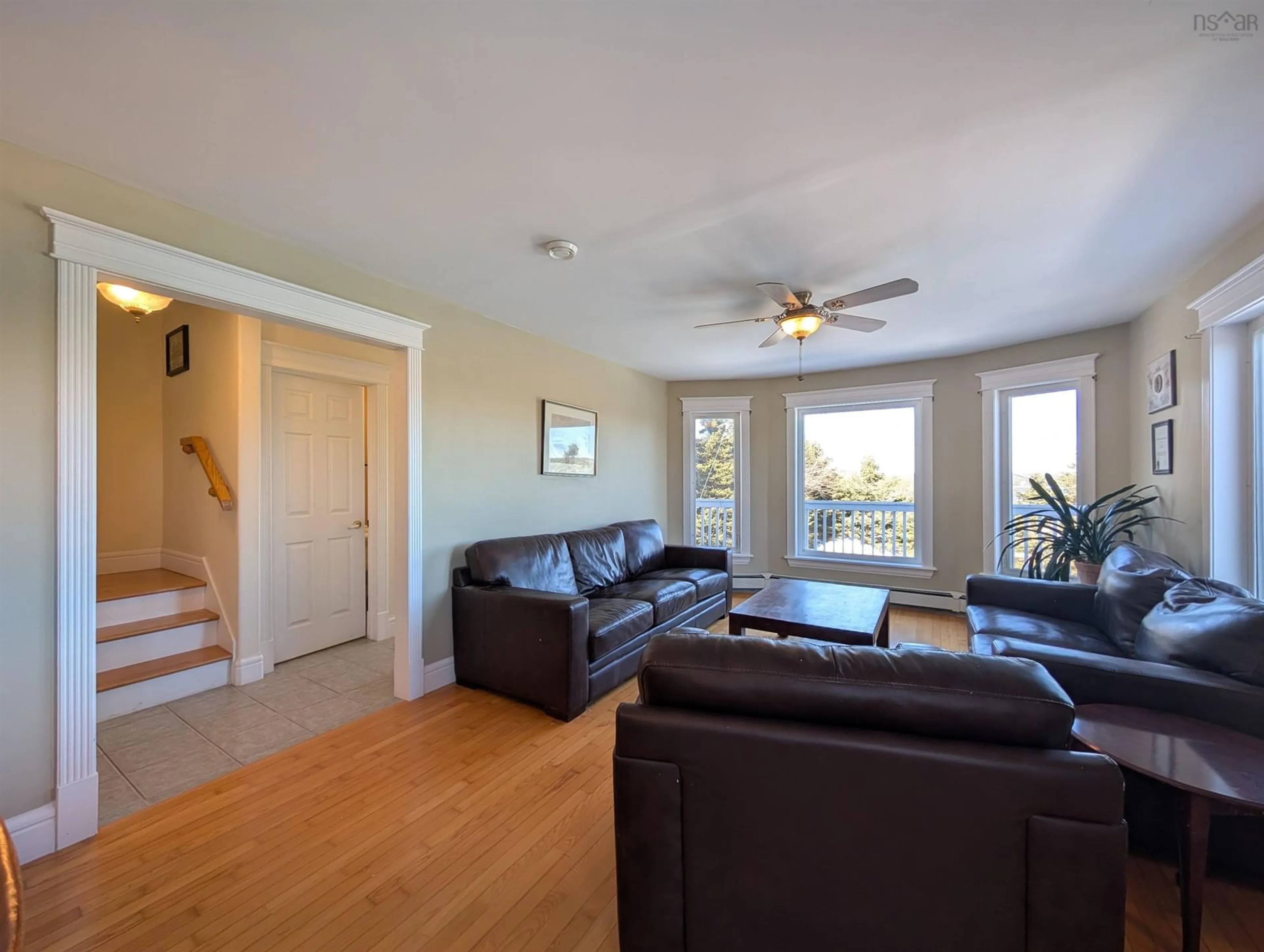 Living room with furniture, wood/laminate floor for 52 Appletree Hill, Shad Bay Nova Scotia B3T 2B7