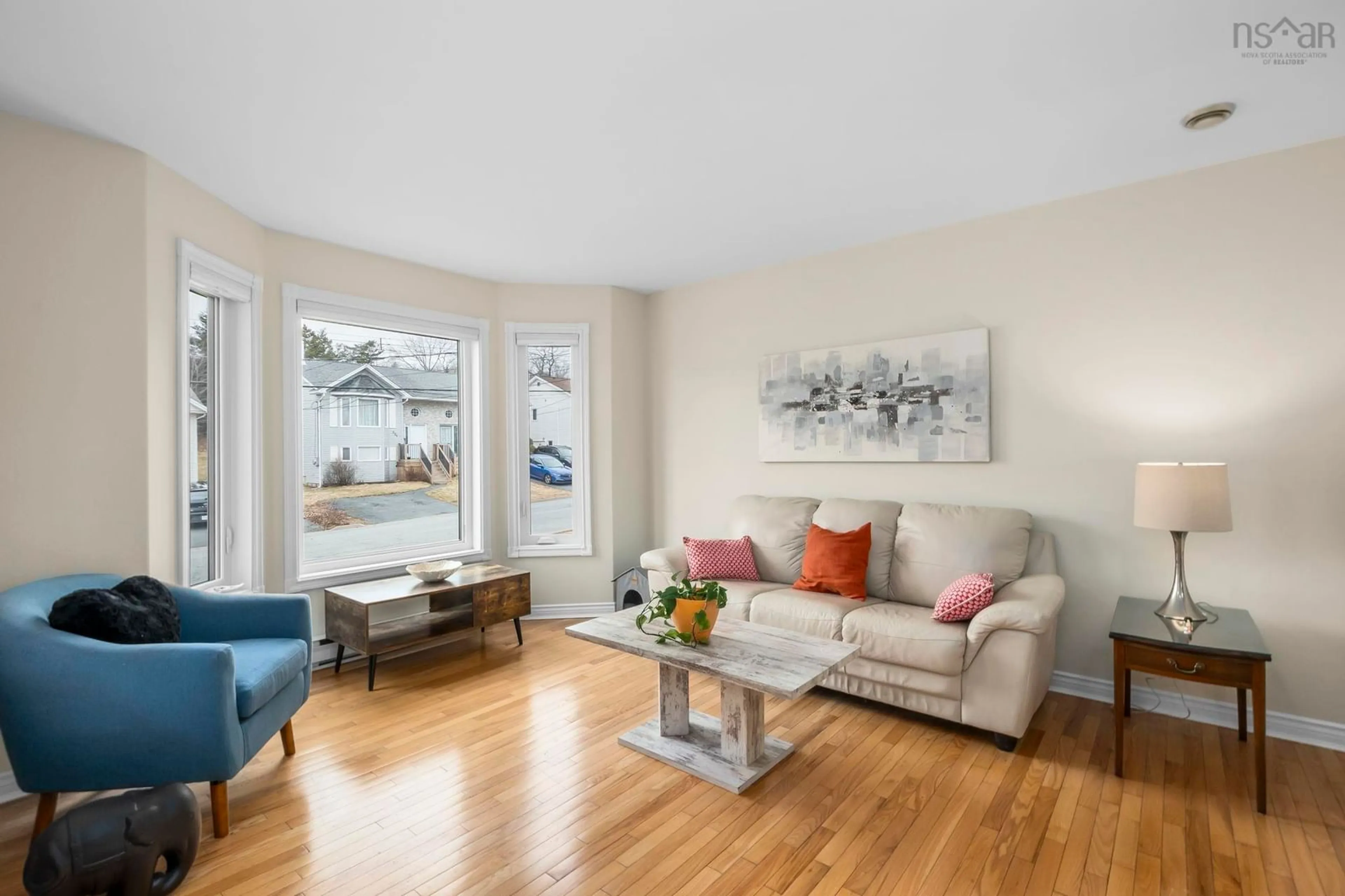 Living room with furniture, wood/laminate floor for 228 Charles Rd, Timberlea Nova Scotia B3T 1N5