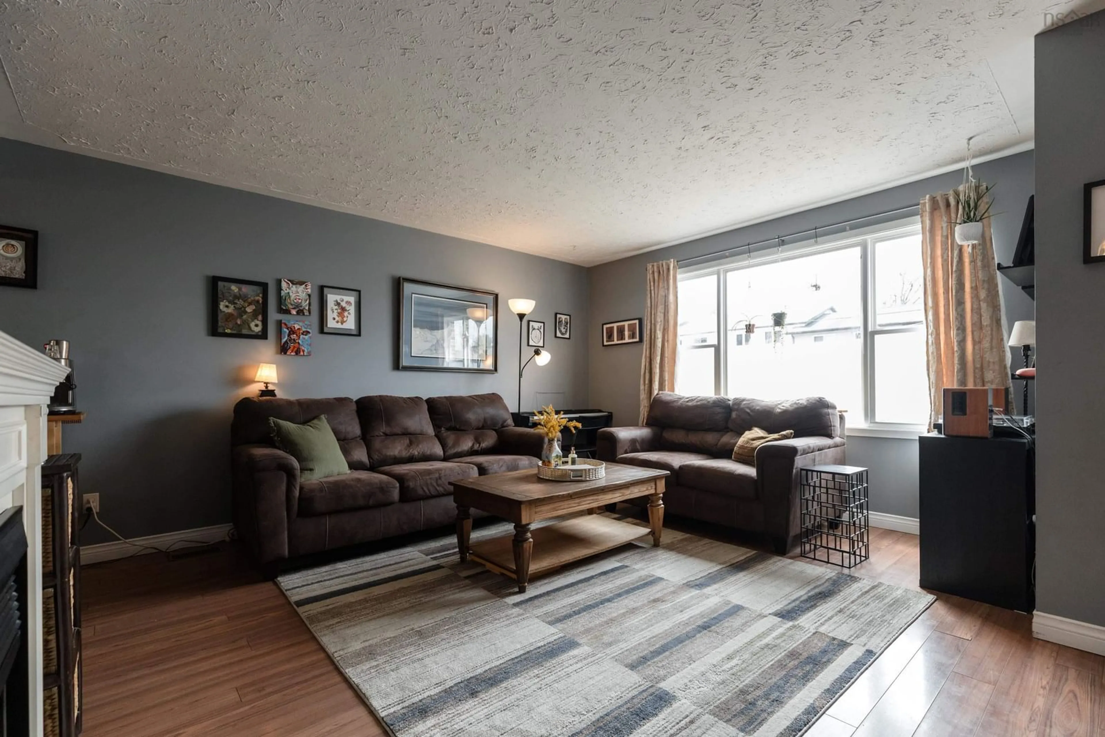 Living room with furniture, wood/laminate floor for 20 Matador Crt, Lower Sackville Nova Scotia B4C 3G9