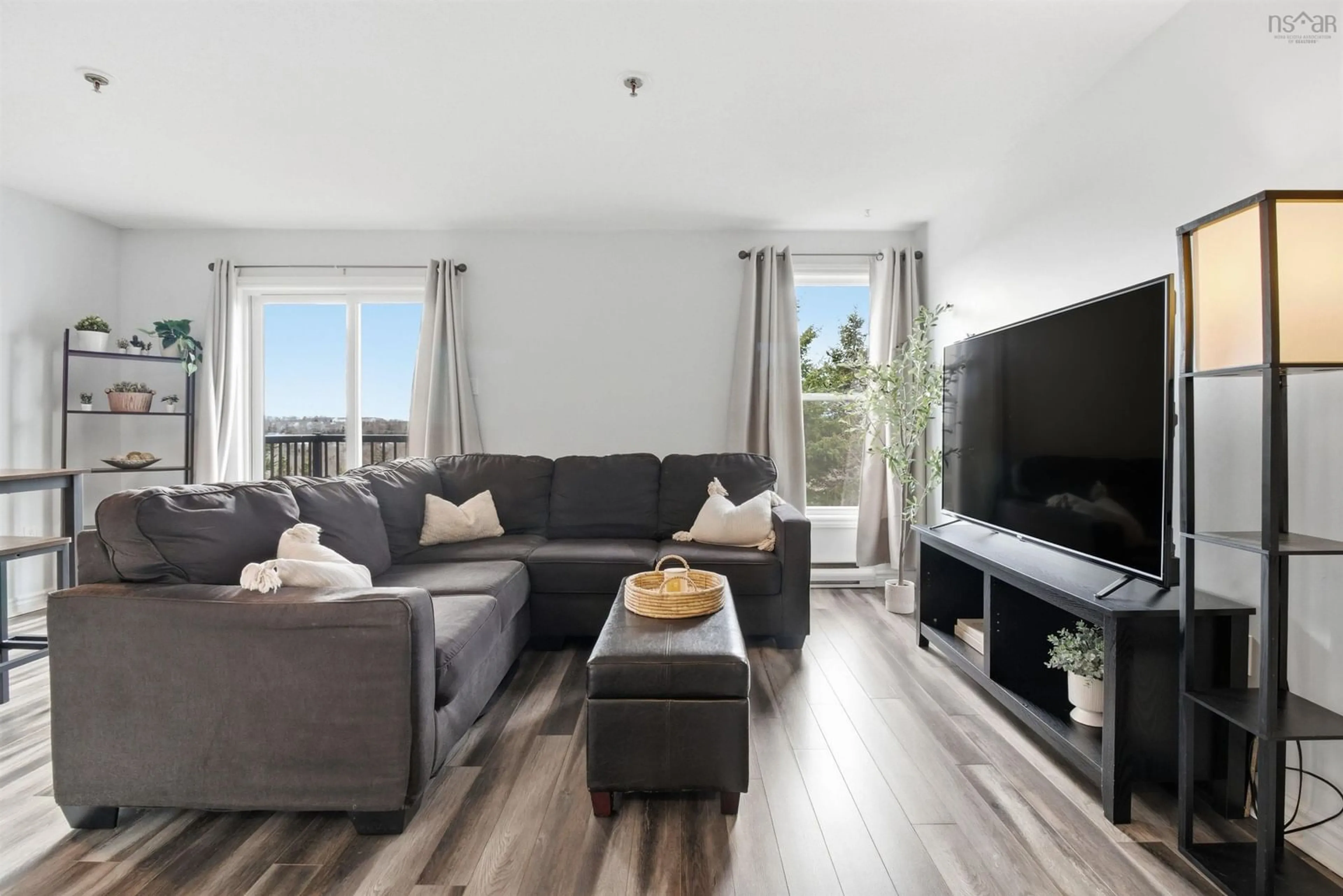 Living room with furniture, wood/laminate floor for 75 Collins Grove #215, Dartmouth Nova Scotia B2W 6B3