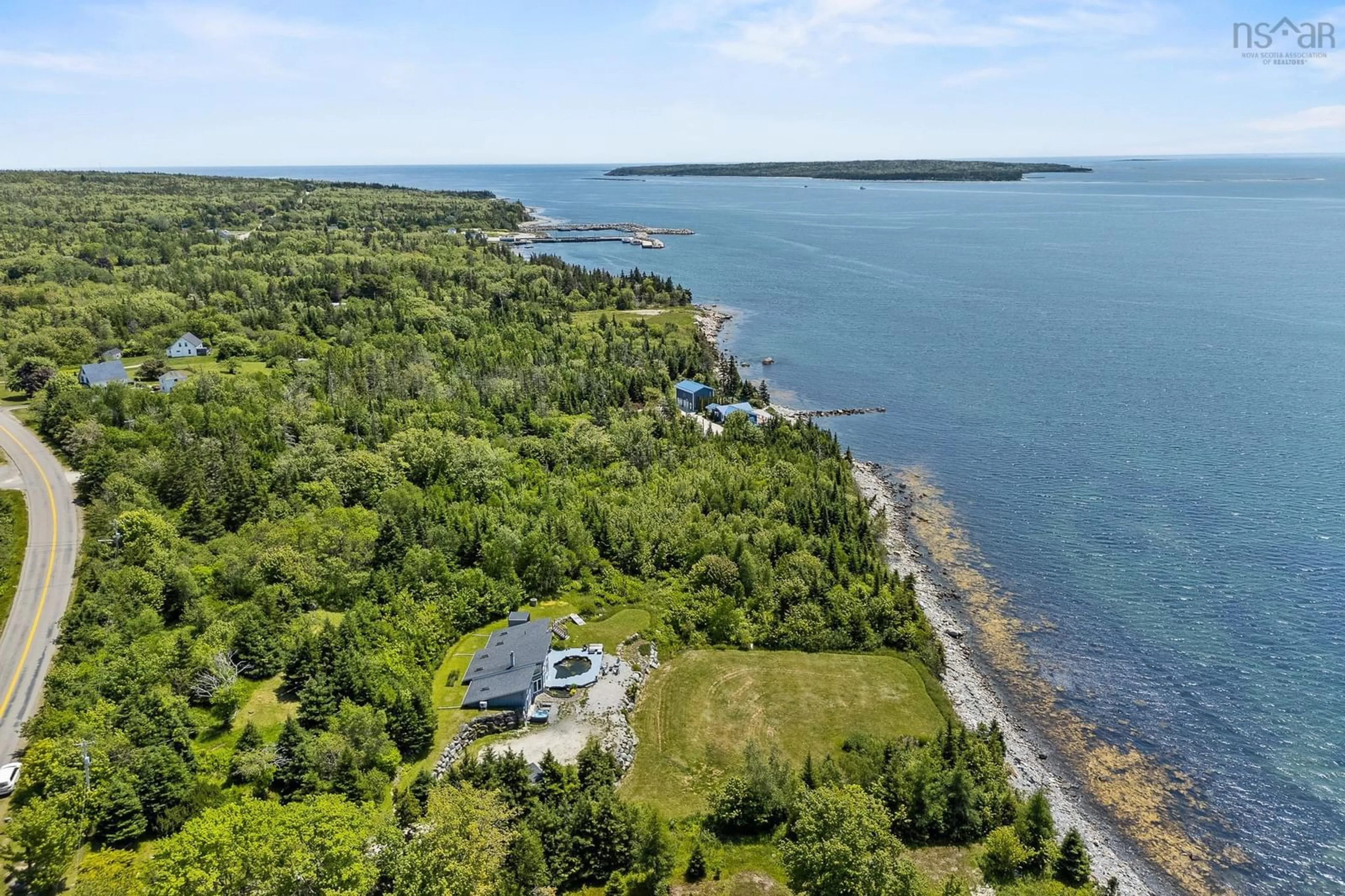 A pic from outside/outdoor area/front of a property/back of a property/a pic from drone, water/lake/river/ocean view for 1878 Sandy Point Rd, Sandy Point Nova Scotia B0T 1W0