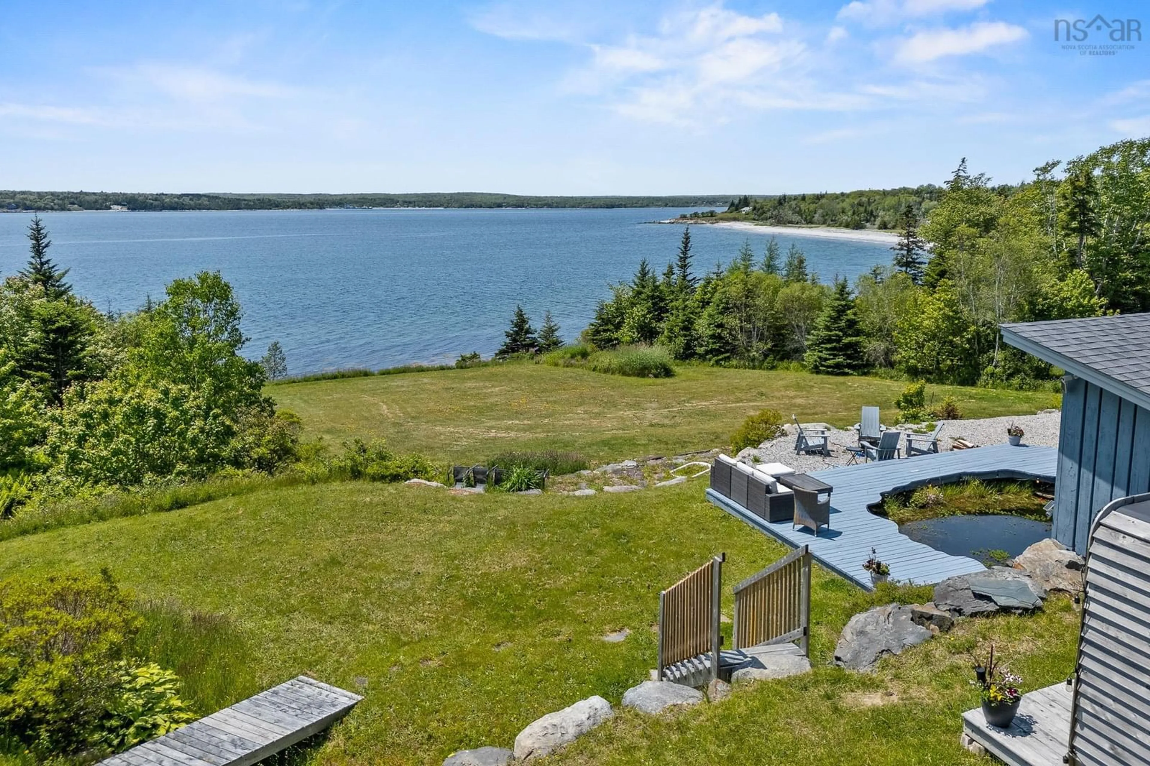 A pic from outside/outdoor area/front of a property/back of a property/a pic from drone, water/lake/river/ocean view for 1878 Sandy Point Rd, Sandy Point Nova Scotia B0T 1W0