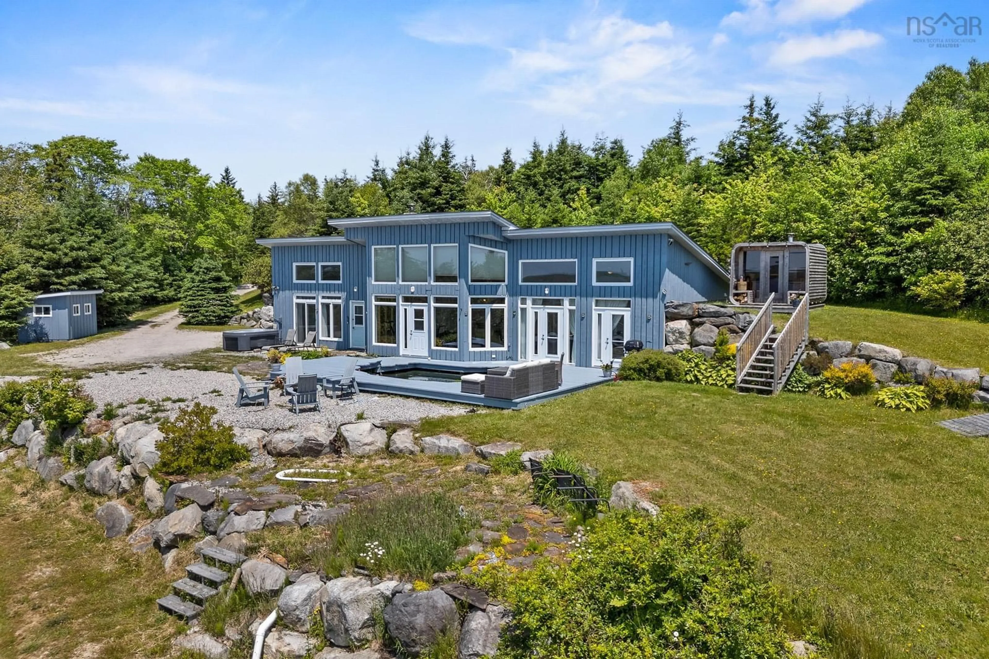 A pic from outside/outdoor area/front of a property/back of a property/a pic from drone, water/lake/river/ocean view for 1878 Sandy Point Rd, Sandy Point Nova Scotia B0T 1W0