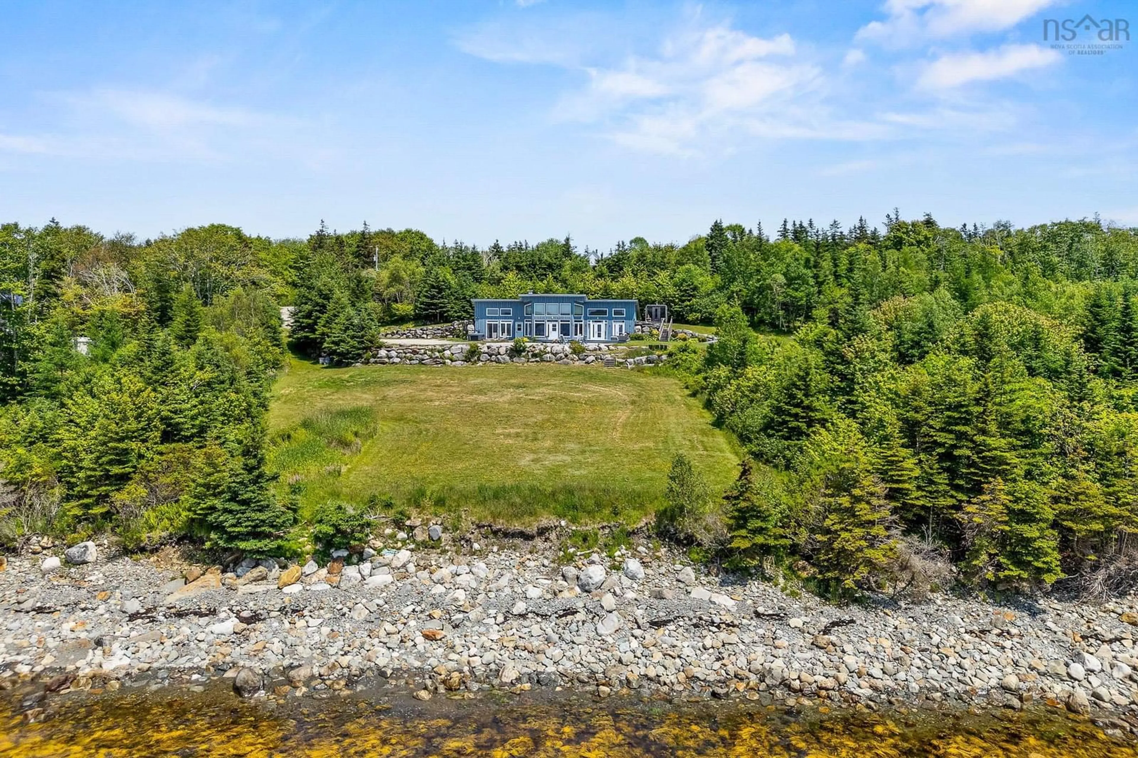 A pic from outside/outdoor area/front of a property/back of a property/a pic from drone, water/lake/river/ocean view for 1878 Sandy Point Rd, Sandy Point Nova Scotia B0T 1W0
