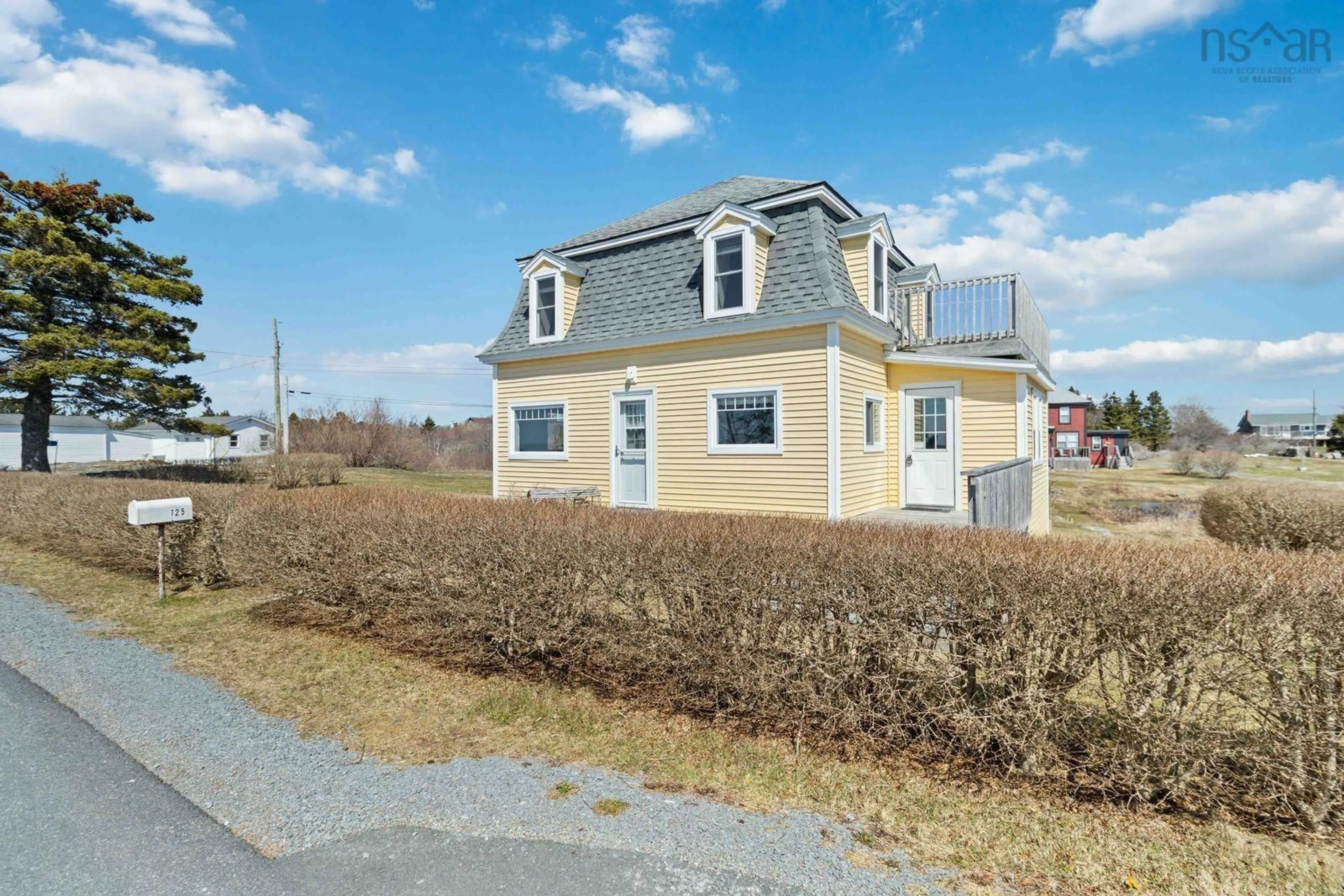 A pic from outside/outdoor area/front of a property/back of a property/a pic from drone, street for 125 The Point Rd, Blue Rocks Nova Scotia B0J 2C0