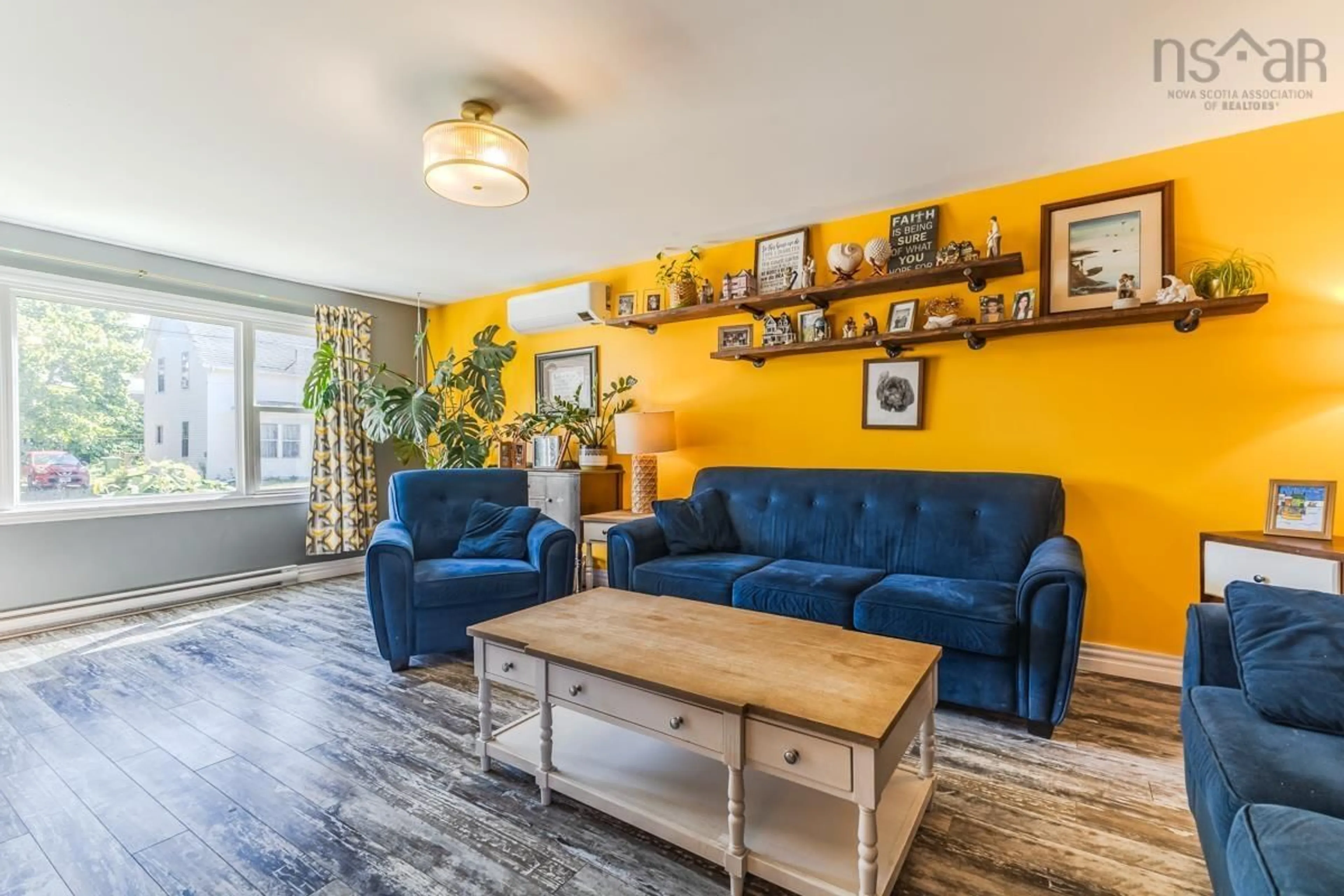 Living room with furniture, wood/laminate floor for 33 Victoria St, Pugwash Nova Scotia B0K 1L0