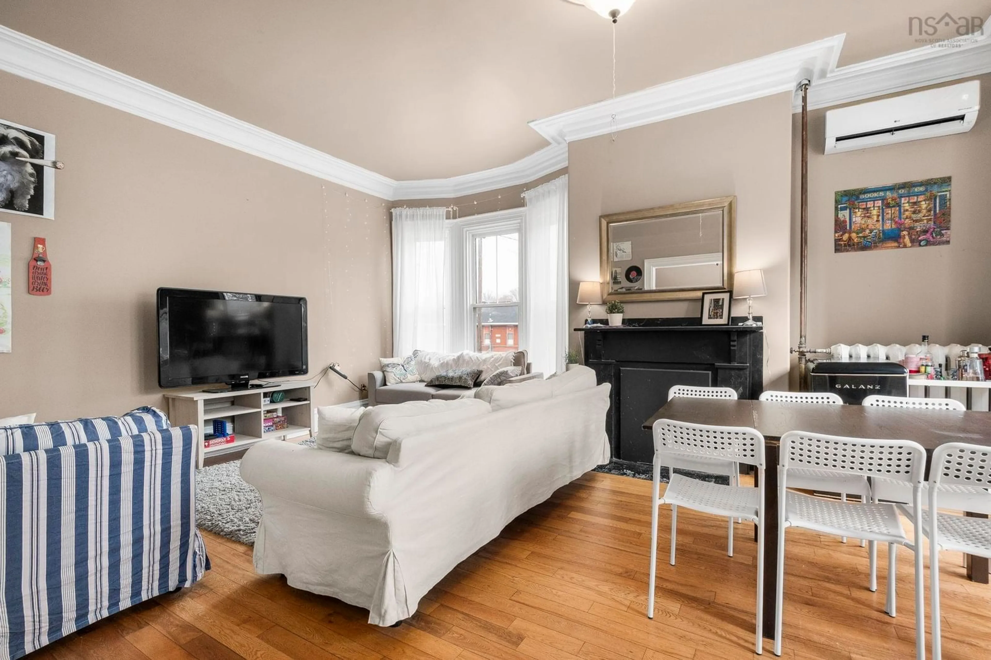 Living room with furniture, wood/laminate floor for 1538 Lemarchant St, Halifax Nova Scotia B3H 3R1