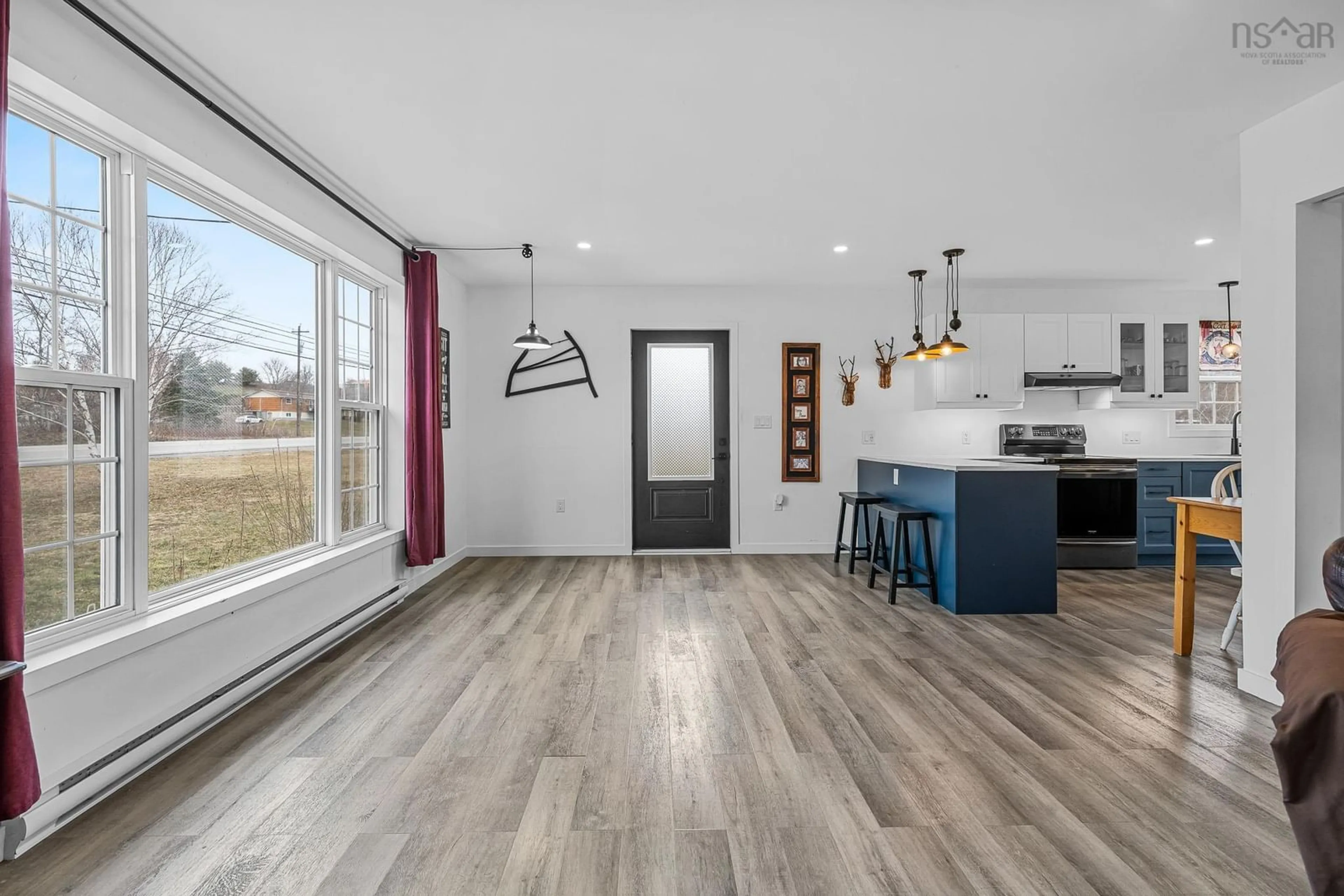 Open concept kitchen, wood/laminate floor for 4866 Highway 1, Three Mile Plains Nova Scotia B0N 2T0