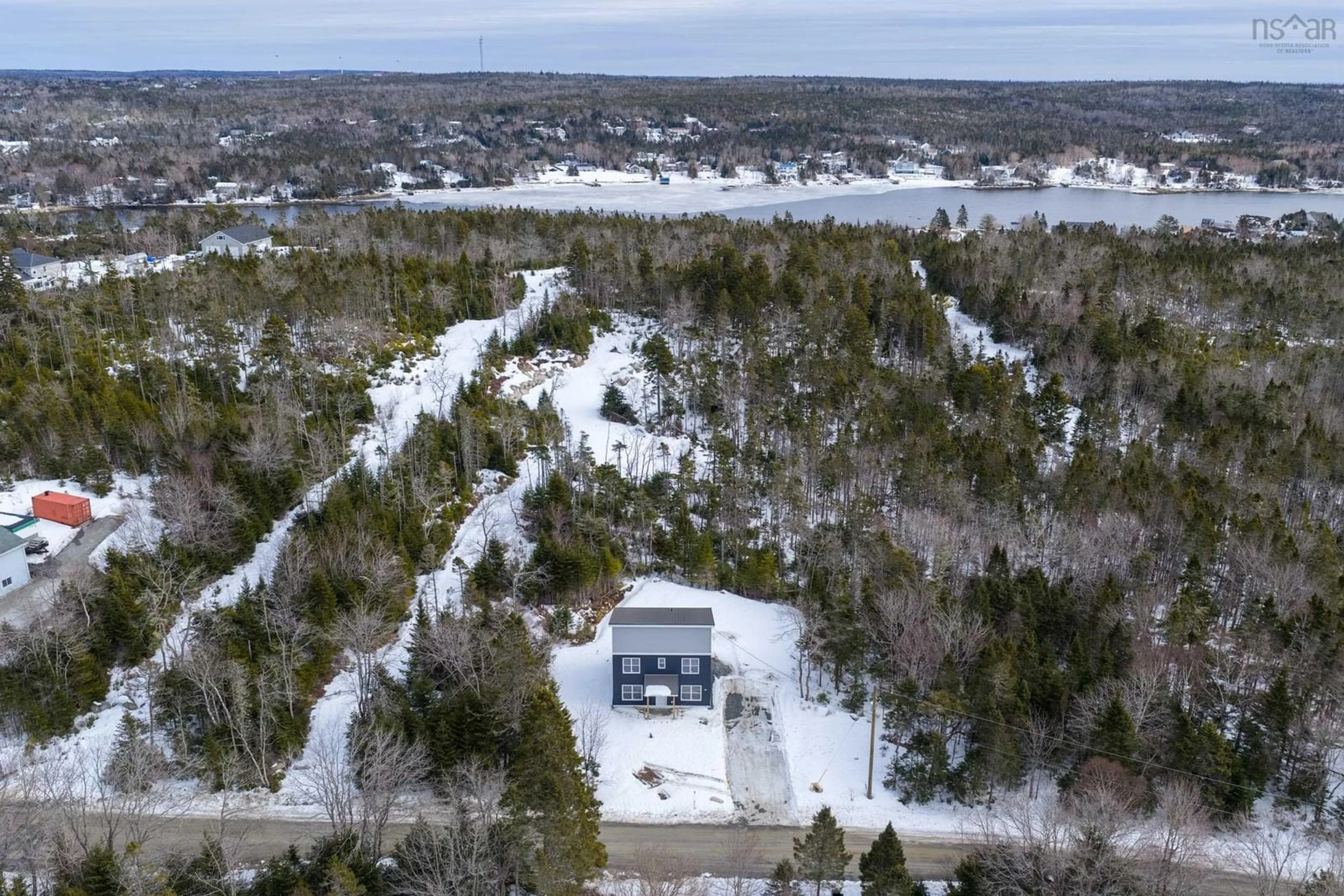A pic from outside/outdoor area/front of a property/back of a property/a pic from drone, water/lake/river/ocean view for 125 Burkes Rd, Shad Bay Nova Scotia B3T 2B4