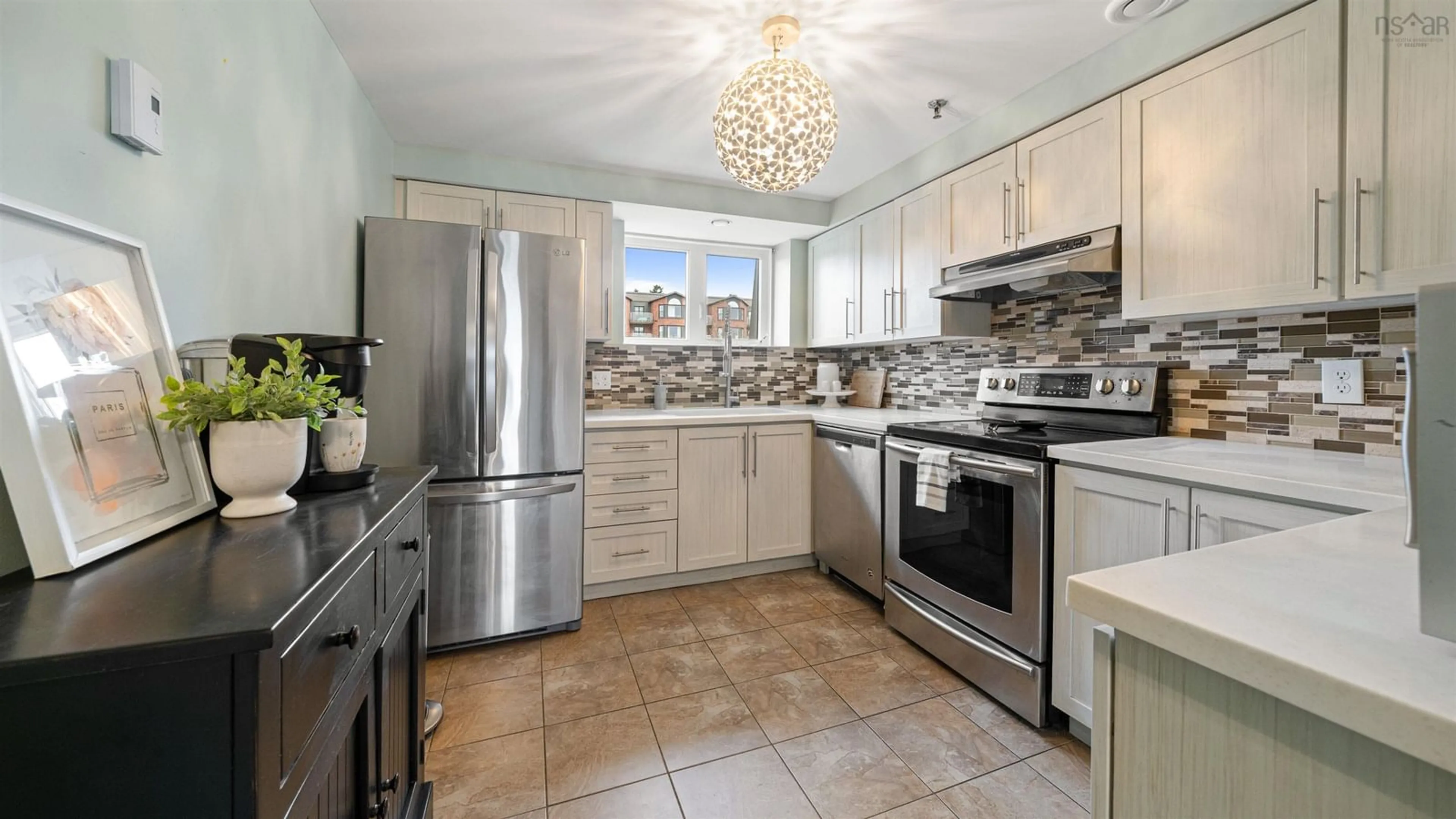 Open concept kitchen, ceramic/tile floor for 61 Nelsons Landing #507, Bedford Nova Scotia B4A 3X3