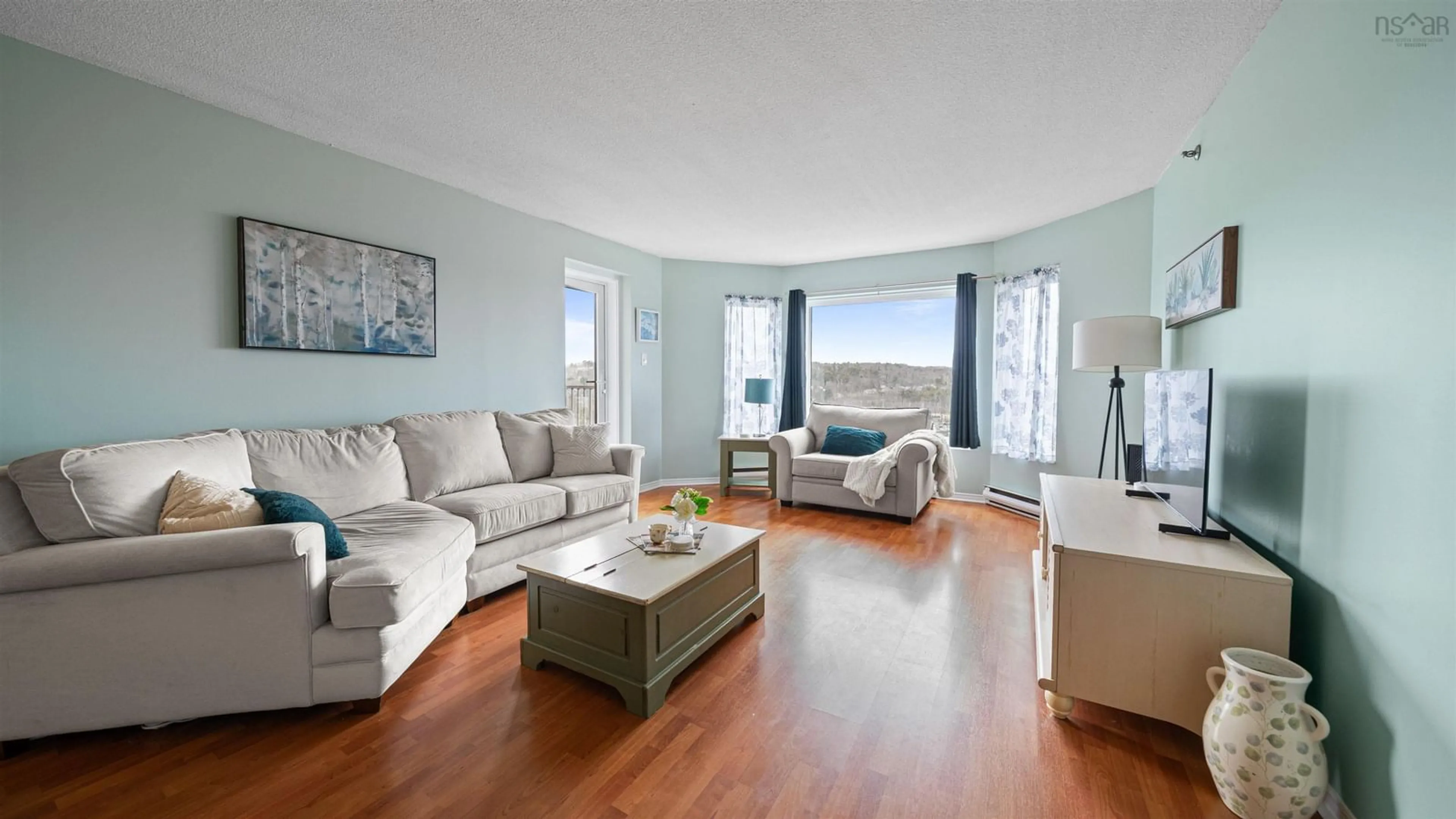 Living room with furniture, wood/laminate floor for 61 Nelsons Landing #507, Bedford Nova Scotia B4A 3X3