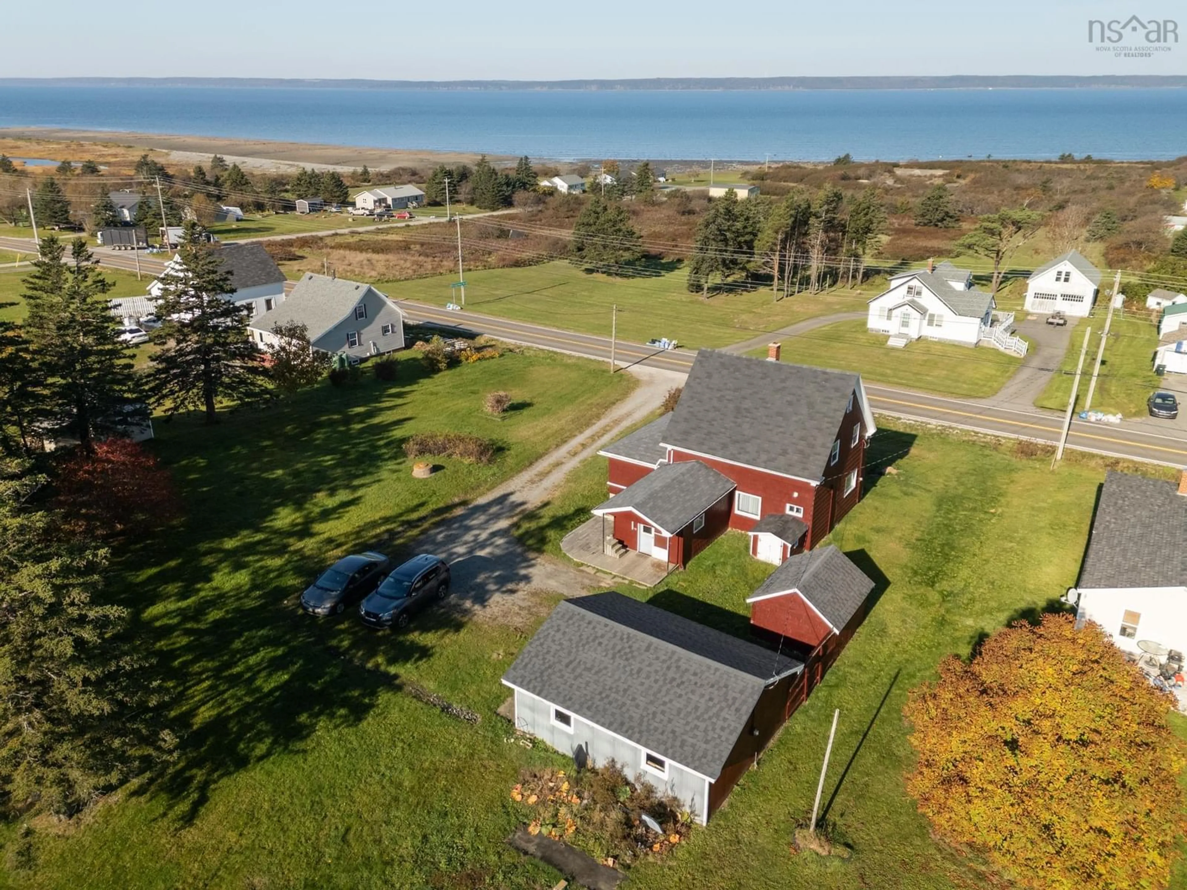 A pic from outside/outdoor area/front of a property/back of a property/a pic from drone, water/lake/river/ocean view for 2484 Highway 1, Grosses Coques Nova Scotia B0W 1M0