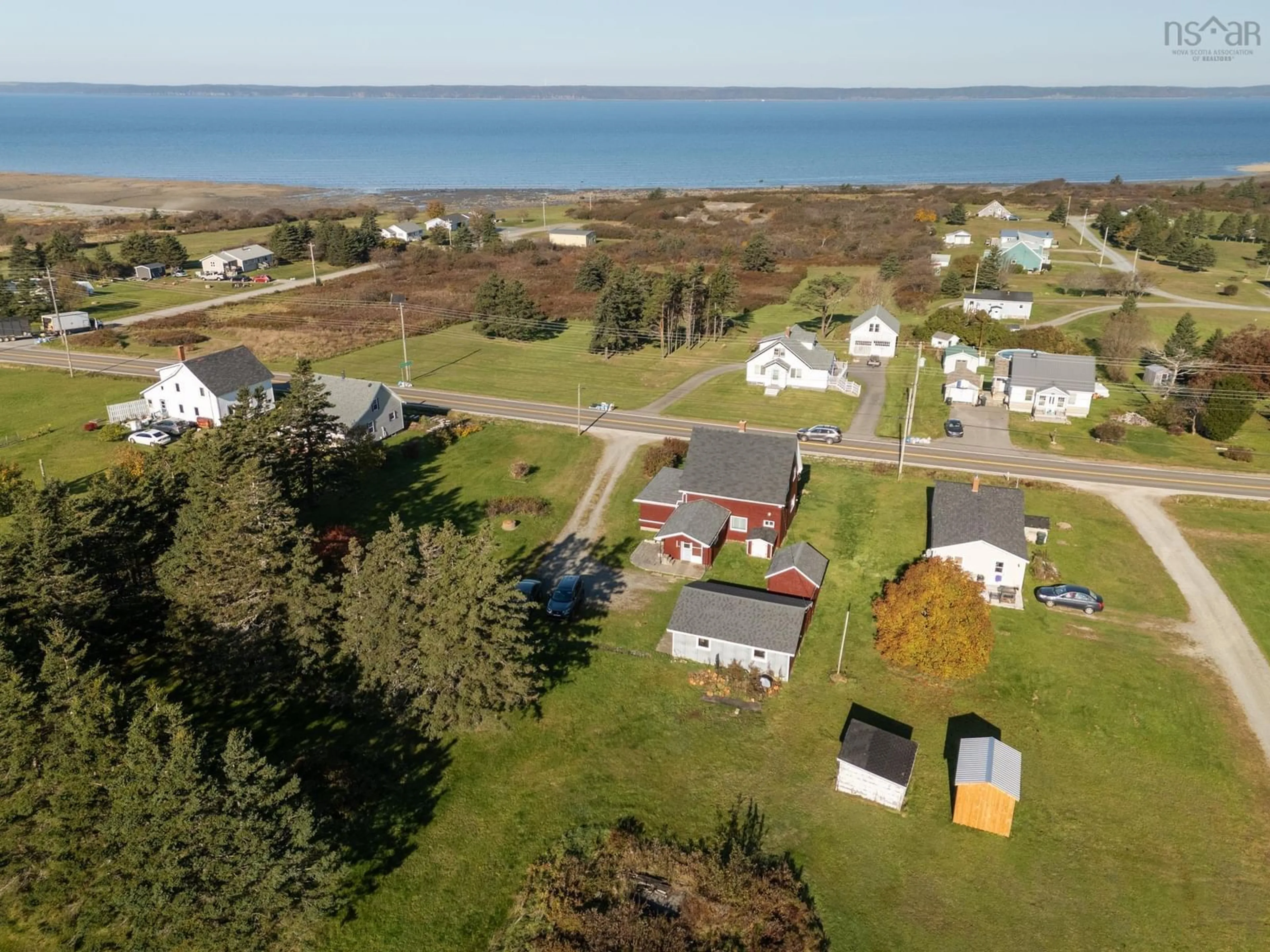 A pic from outside/outdoor area/front of a property/back of a property/a pic from drone, water/lake/river/ocean view for 2484 Highway 1, Grosses Coques Nova Scotia B0W 1M0