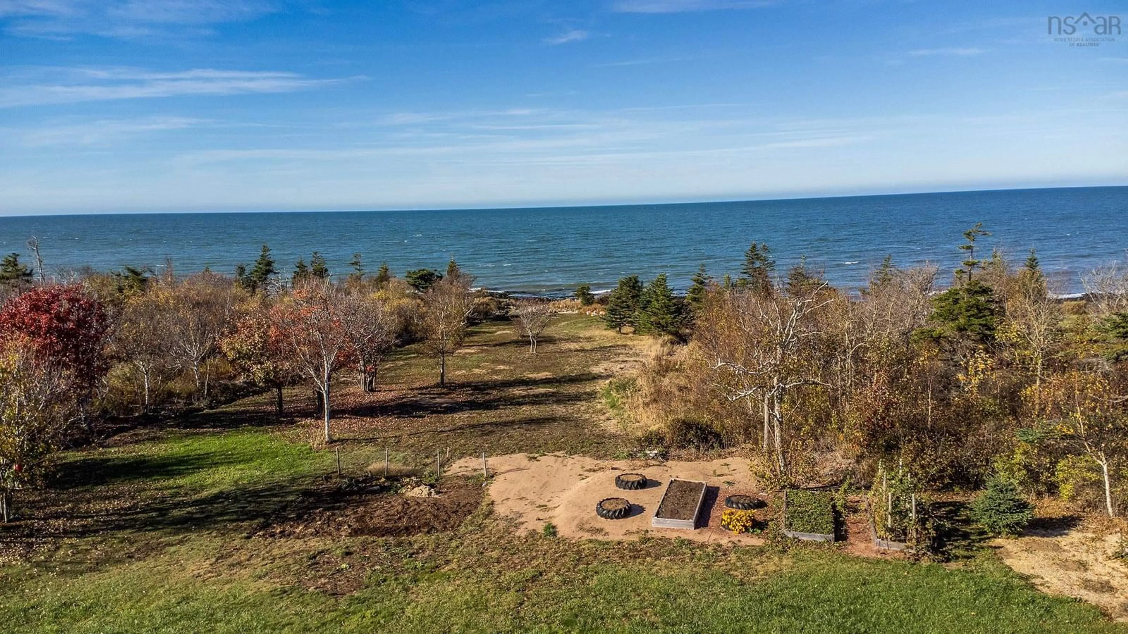 A pic from outside/outdoor area/front of a property/back of a property/a pic from drone, water/lake/river/ocean view for 6437 Shore Road West, Youngs Cove Nova Scotia B0S 1L0