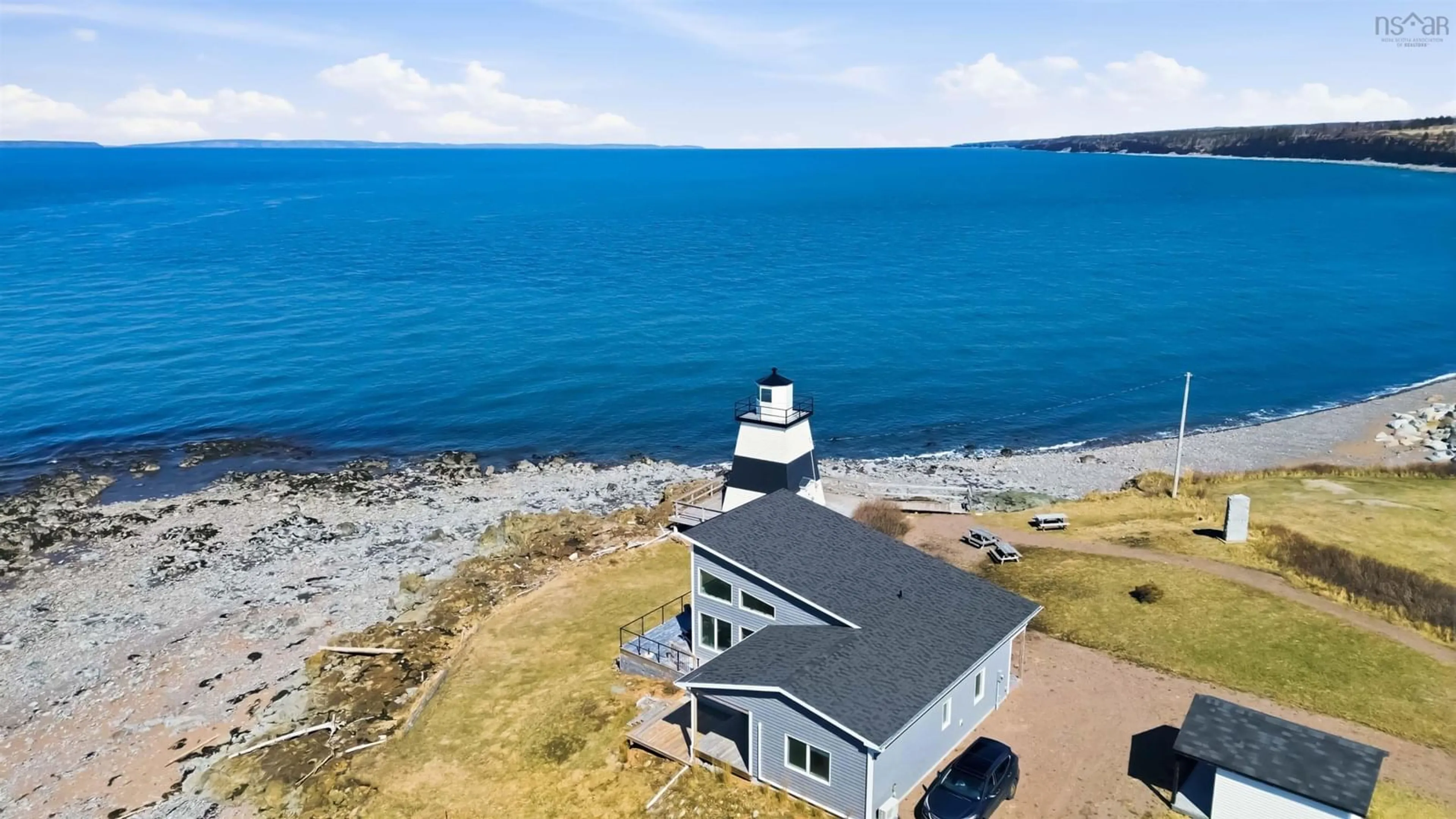 A pic from outside/outdoor area/front of a property/back of a property/a pic from drone, water/lake/river/ocean view for 15 Lighthouse Rd, Margaretsville Nova Scotia B0S 1N0