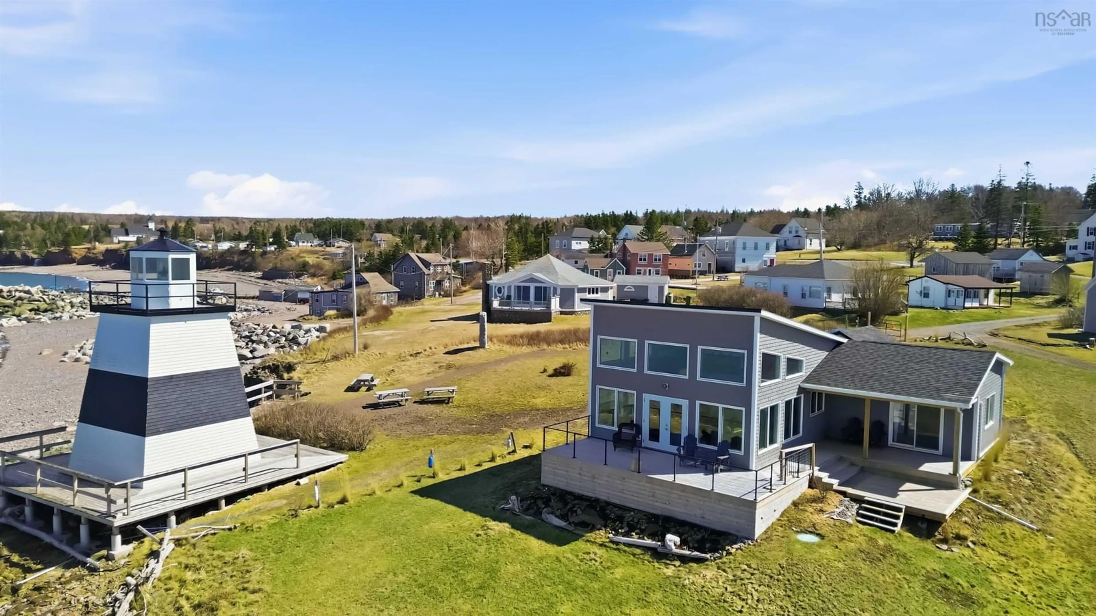 A pic from outside/outdoor area/front of a property/back of a property/a pic from drone, water/lake/river/ocean view for 15 Lighthouse Rd, Margaretsville Nova Scotia B0S 1N0