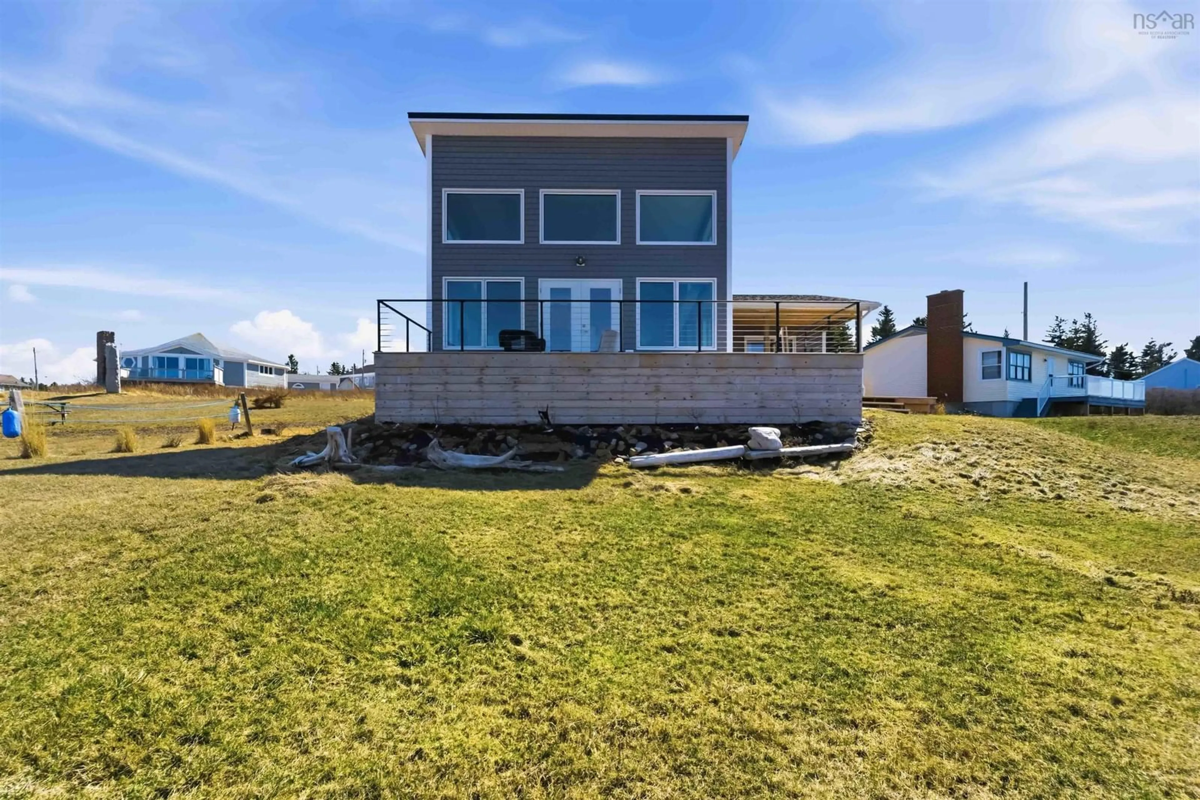 A pic from outside/outdoor area/front of a property/back of a property/a pic from drone, water/lake/river/ocean view for 15 Lighthouse Rd, Margaretsville Nova Scotia B0S 1N0