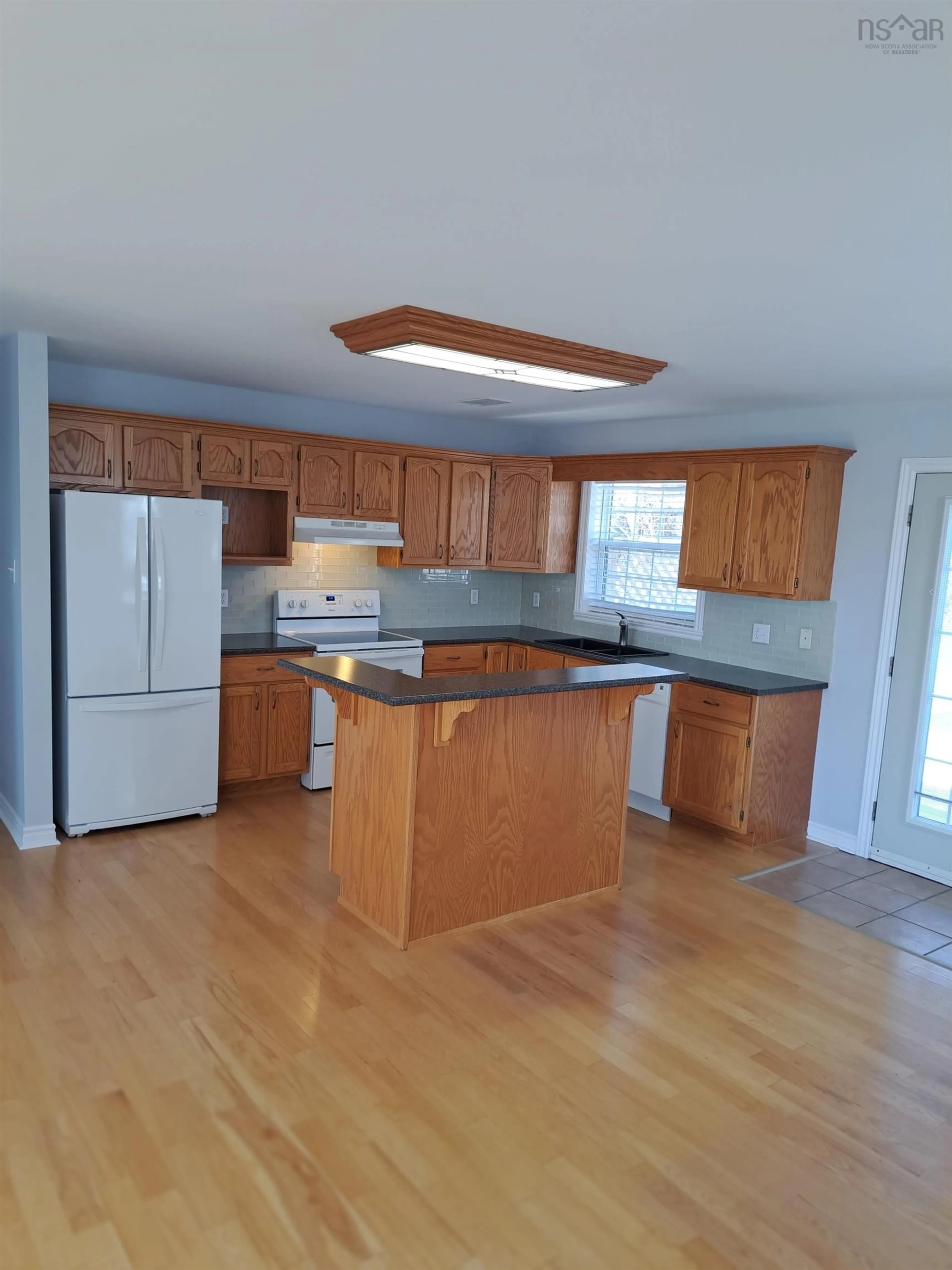 Open concept kitchen, wood/laminate floor for 6 Kingsview Dr, Windsor Nova Scotia B0N 2T0