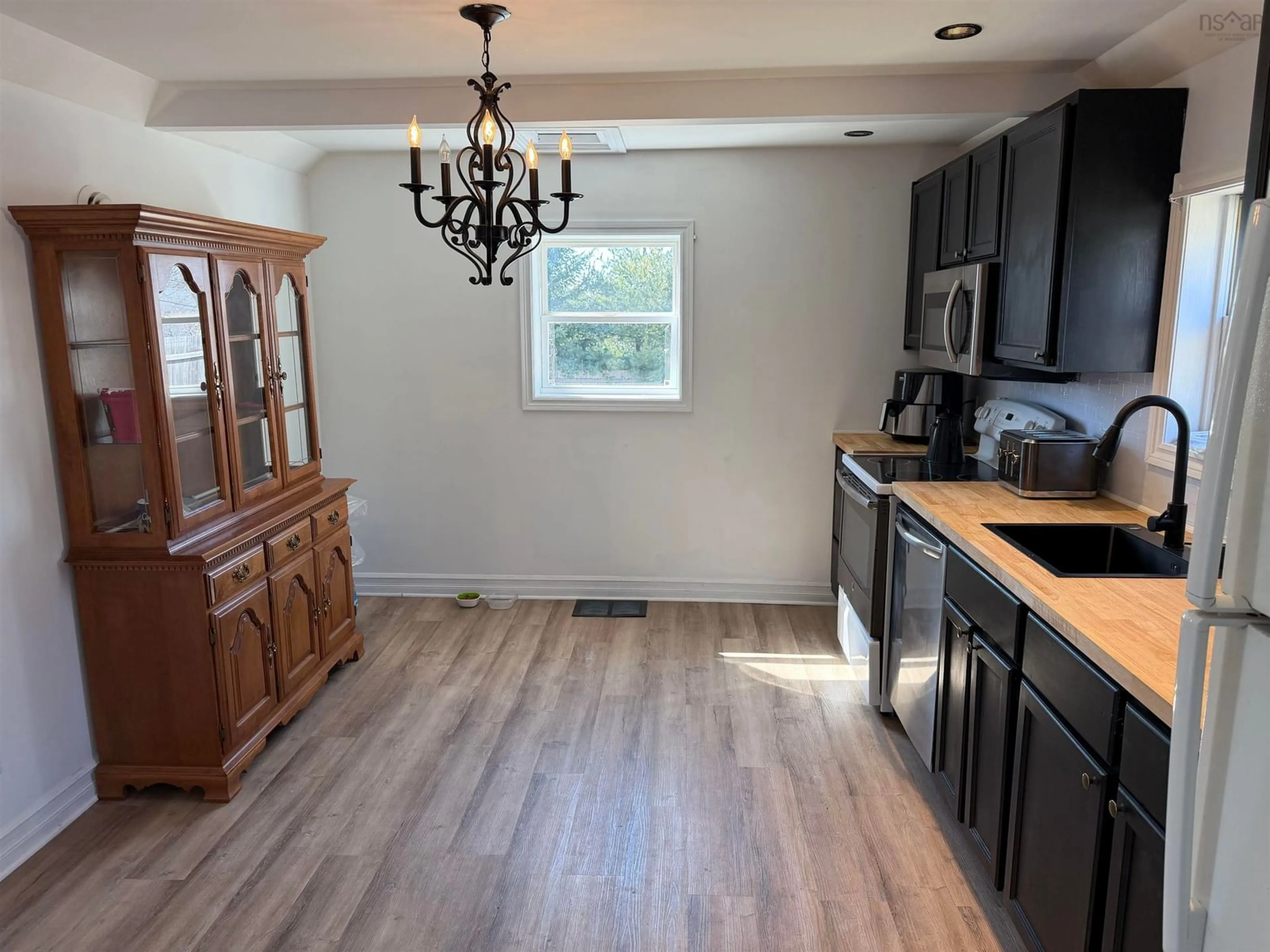 Open concept kitchen, wood/laminate floor for 71 Elliott St, Pictou Nova Scotia B0K 1H0