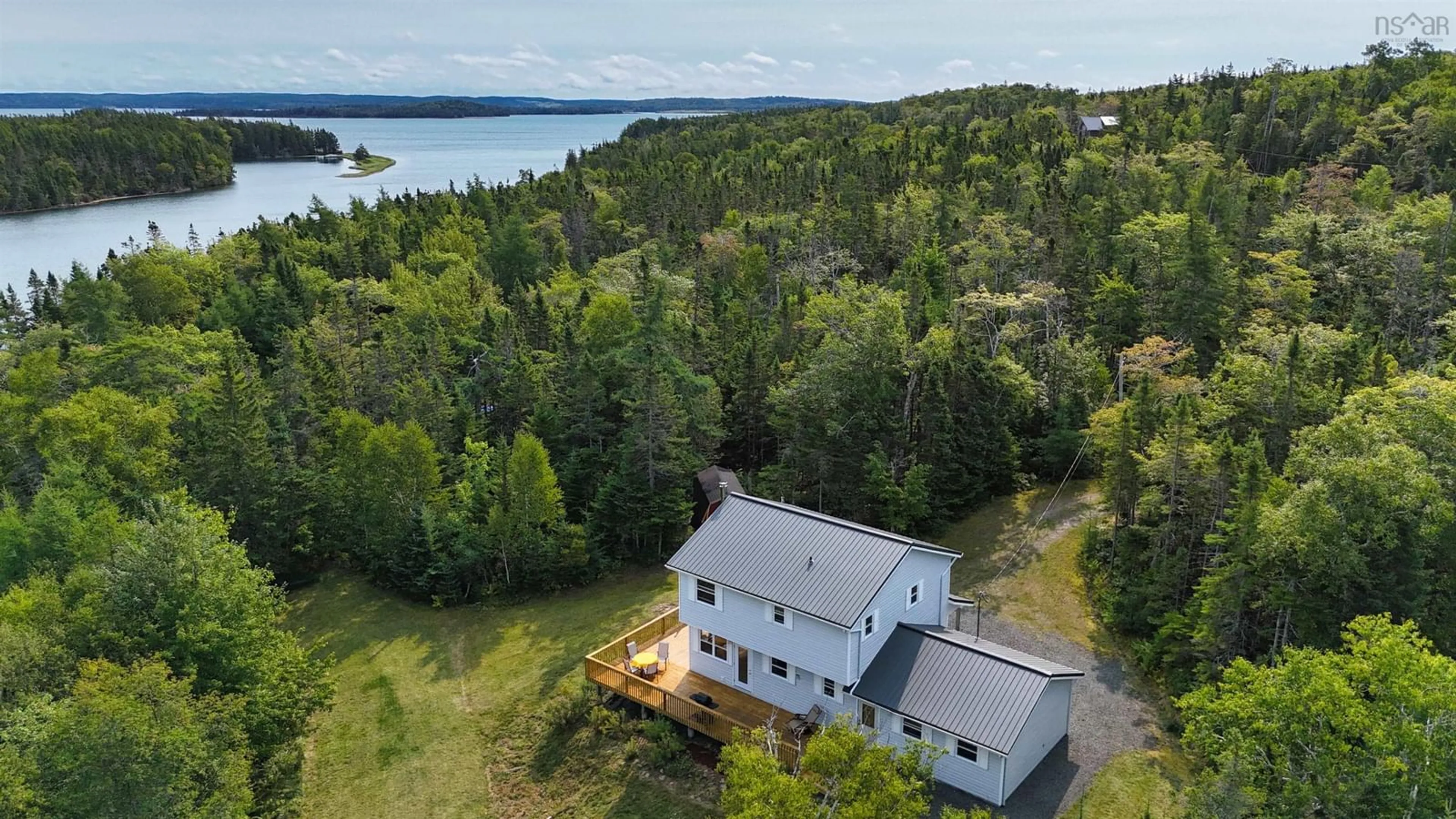 A pic from outside/outdoor area/front of a property/back of a property/a pic from drone, water/lake/river/ocean view for 123 Wall St, Cape George Nova Scotia B0E 3B0