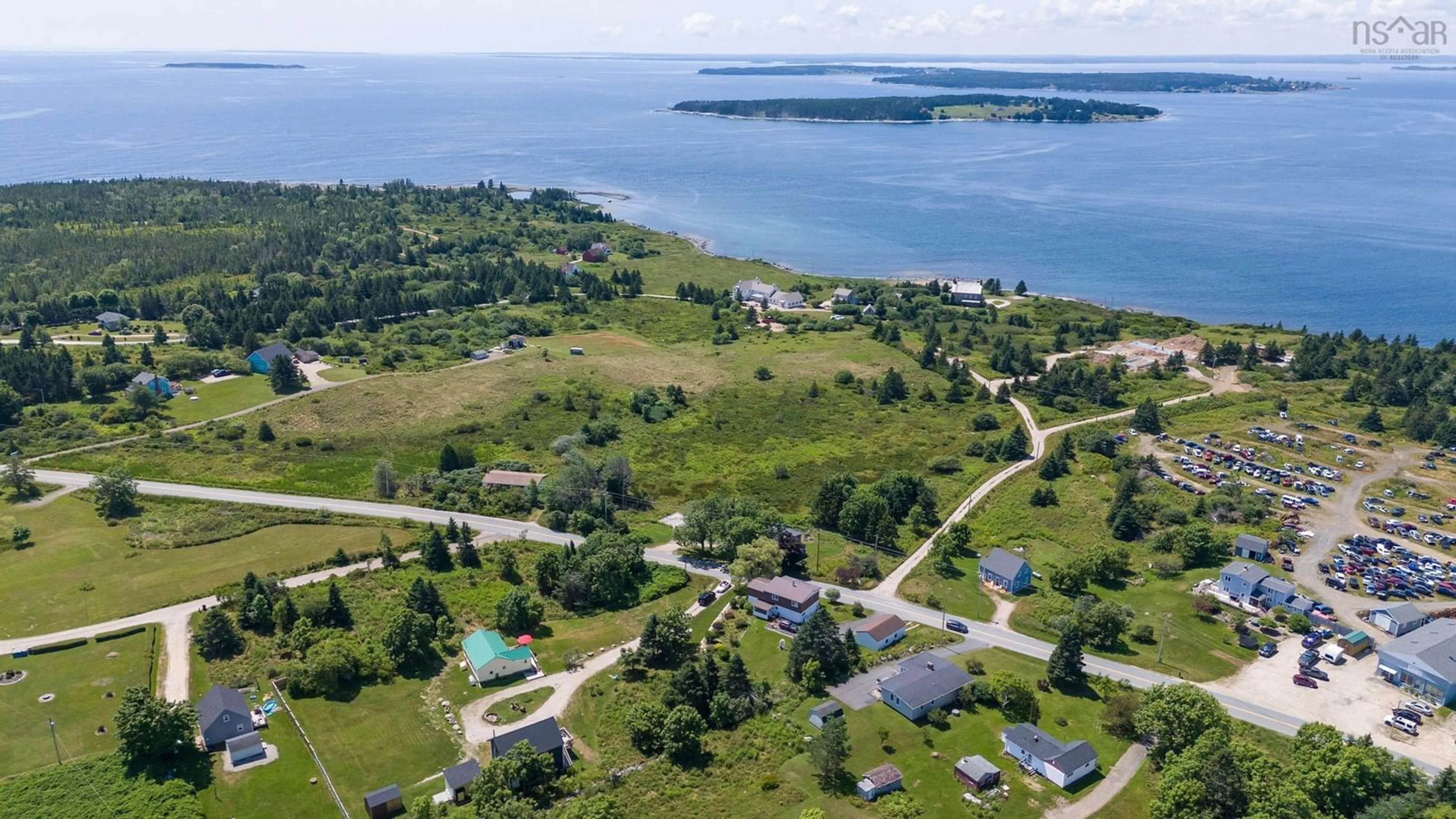 A pic from outside/outdoor area/front of a property/back of a property/a pic from drone, water/lake/river/ocean view for 173 New Harbour Rd, Blandford Nova Scotia B0J 1T0