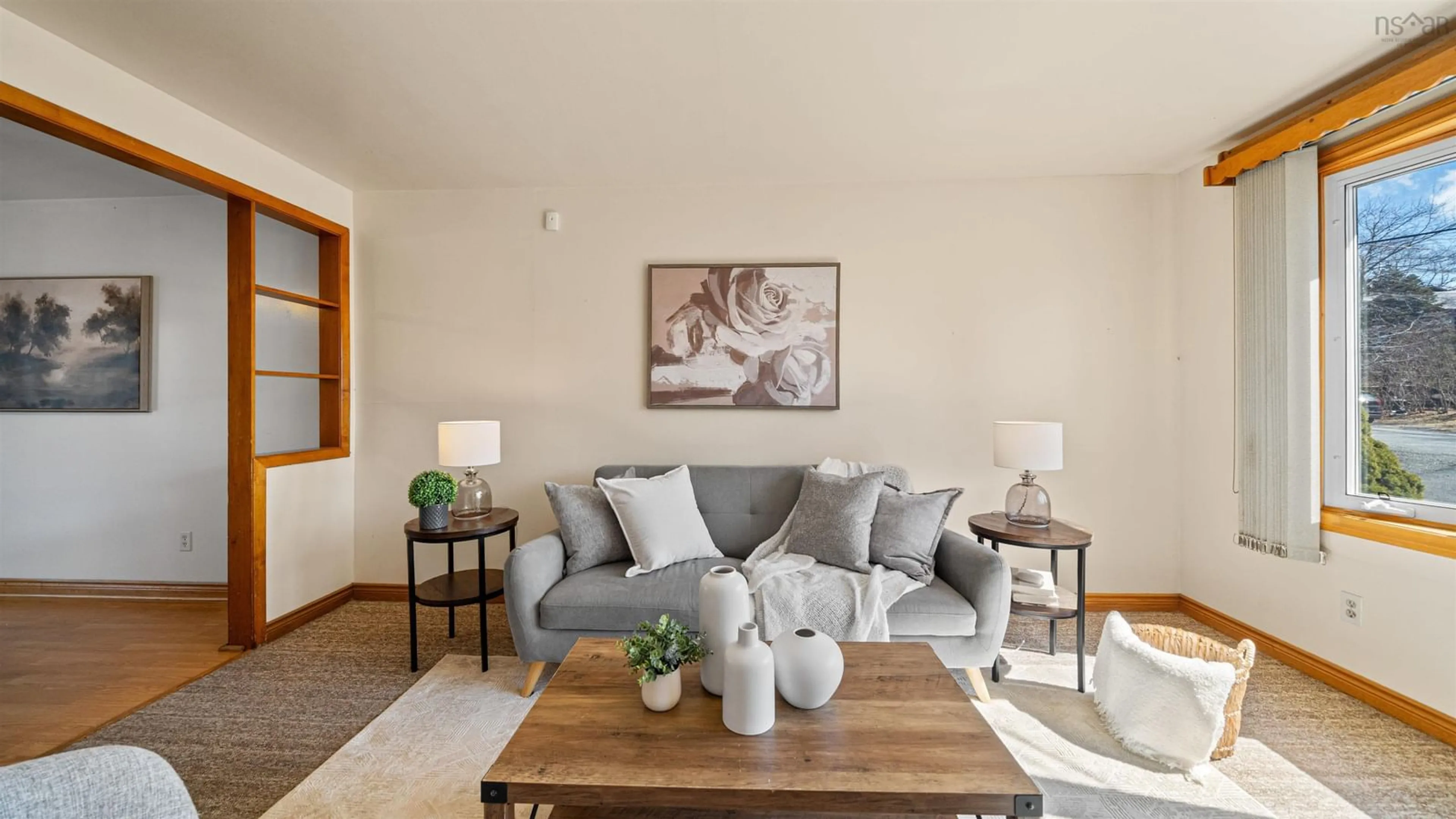 Living room with furniture, wood/laminate floor for 24 Mcintosh St, Spryfield Nova Scotia B3R 1G8