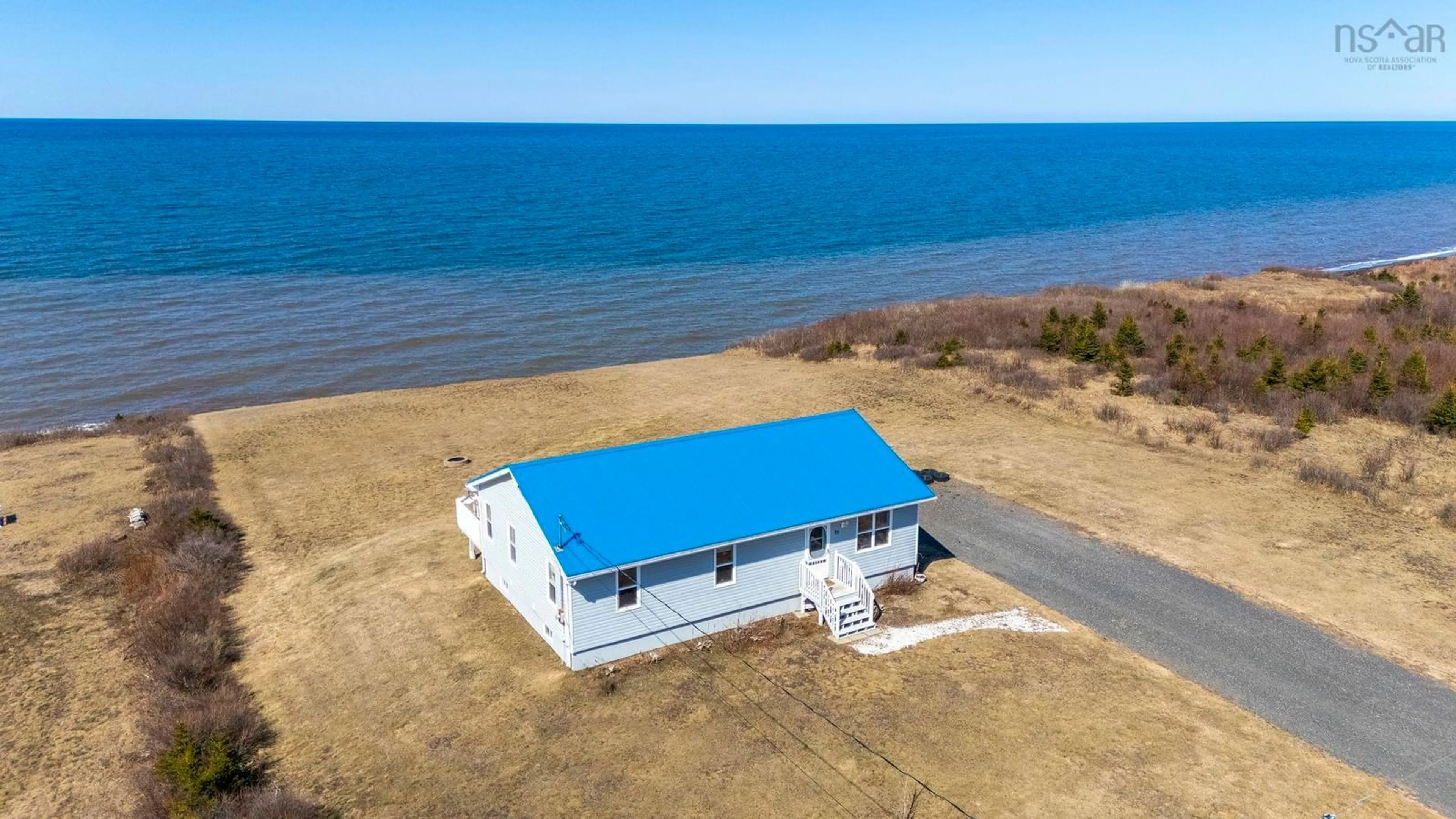 A pic from outside/outdoor area/front of a property/back of a property/a pic from drone, water/lake/river/ocean view for 22 Dawson Dr, Ponds Nova Scotia B0K 1G0
