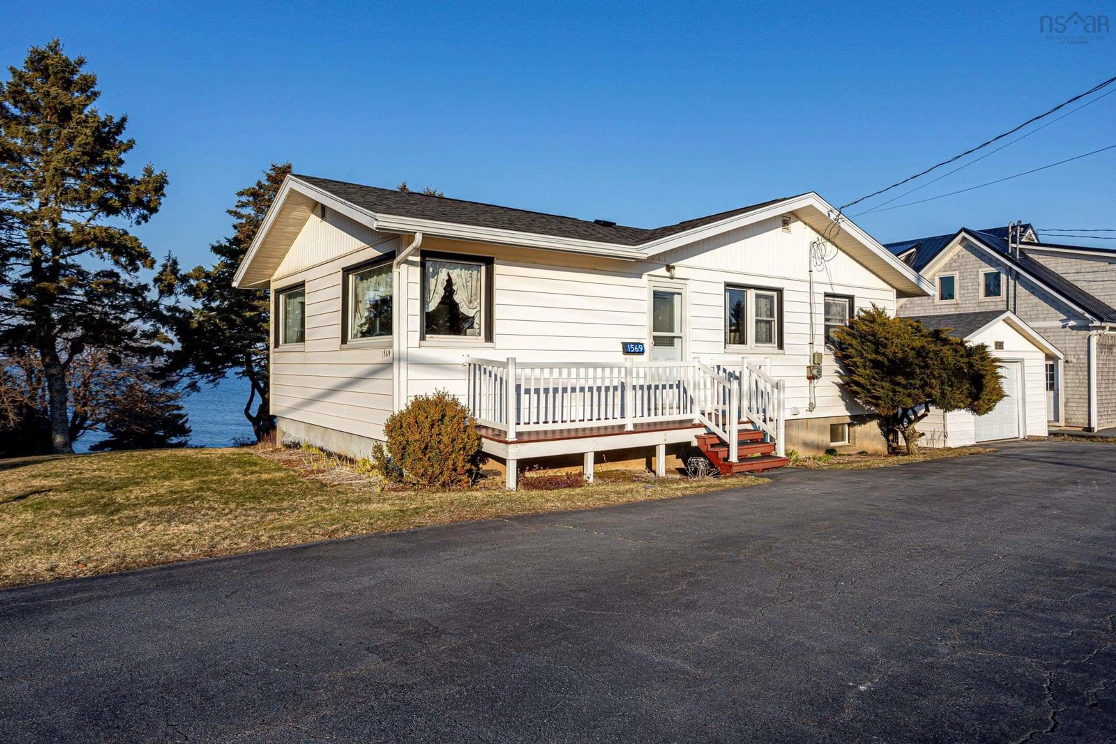 Home with vinyl exterior material, water/lake/river/ocean view for 1569 Cow Bay Rd, Cow Bay Nova Scotia B3G 1L3
