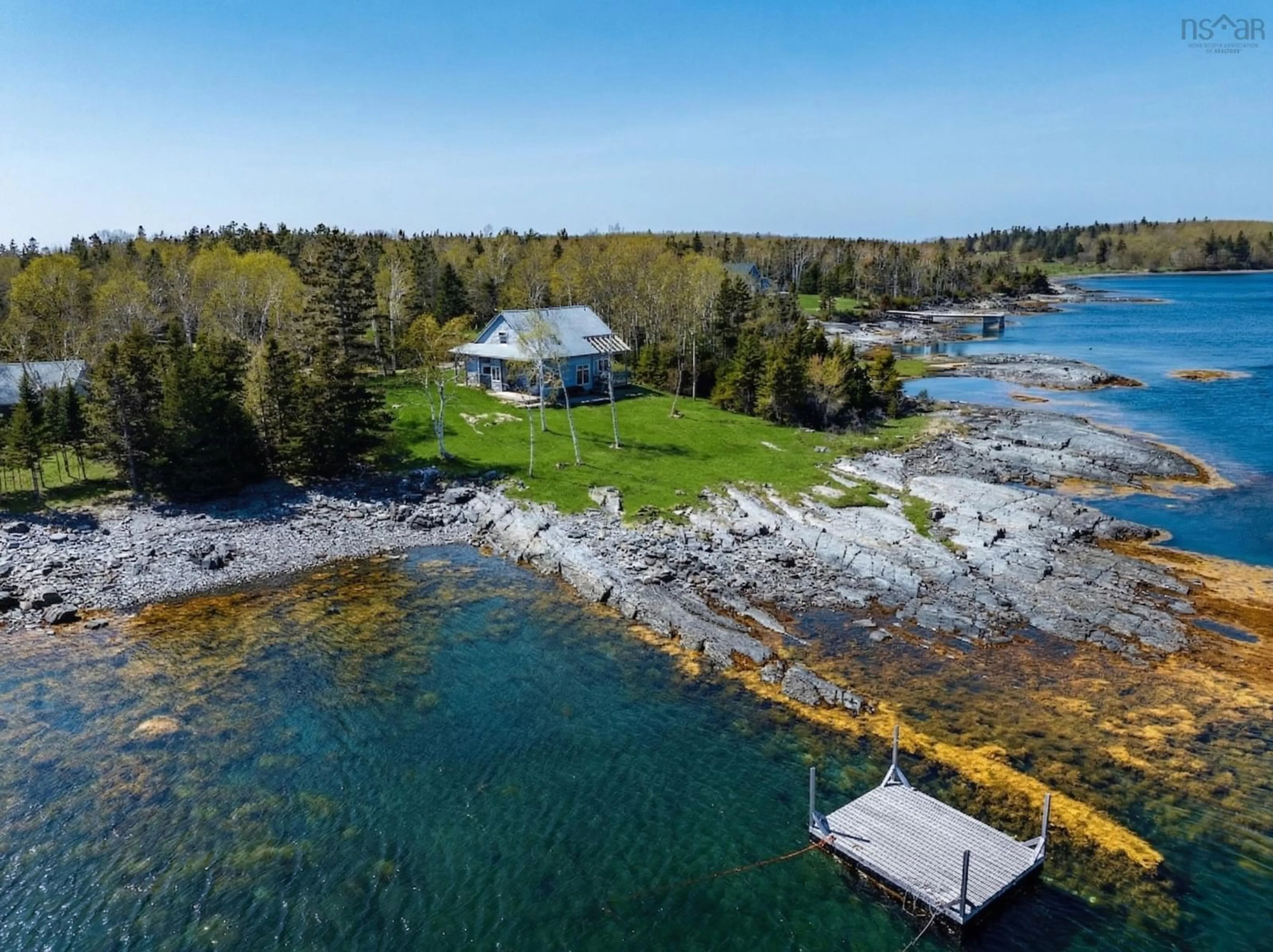 A pic from outside/outdoor area/front of a property/back of a property/a pic from drone, water/lake/river/ocean view for 139 Pine Dr, Heckmans Island Nova Scotia B0J 2C0