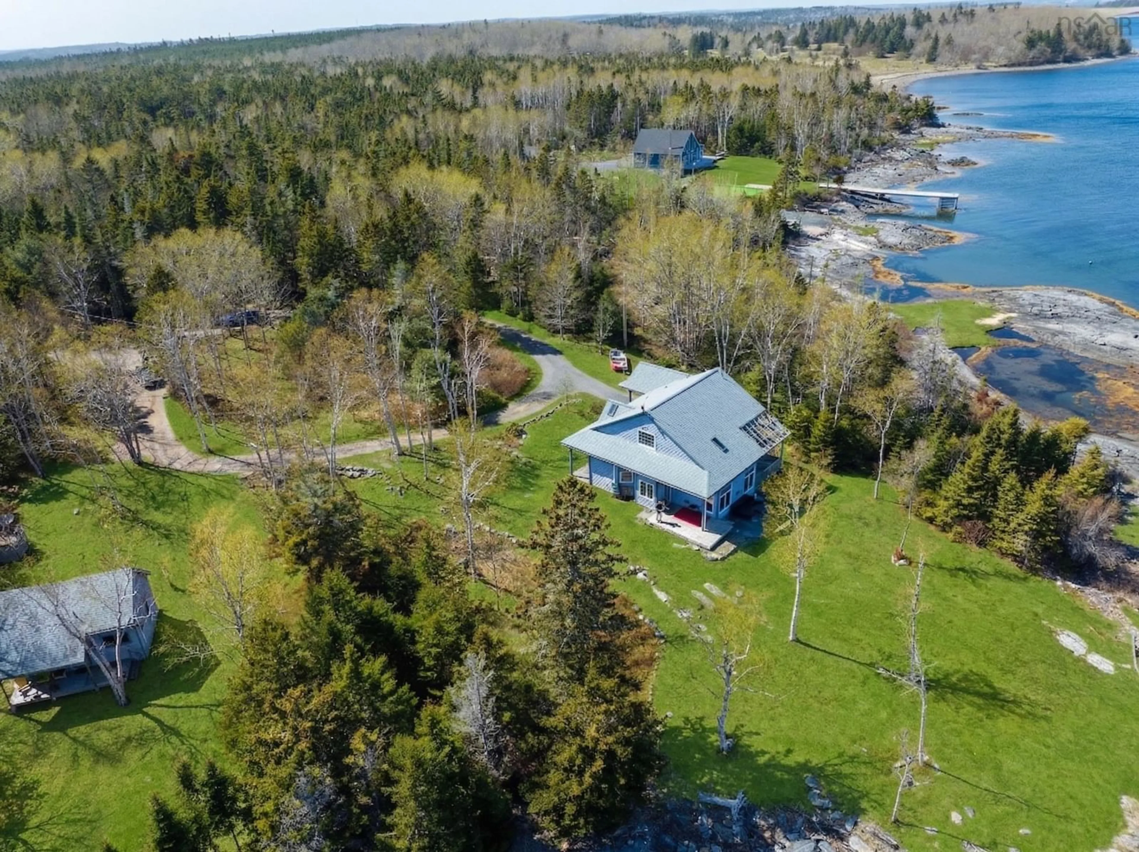 A pic from outside/outdoor area/front of a property/back of a property/a pic from drone, water/lake/river/ocean view for 139 Pine Dr, Heckmans Island Nova Scotia B0J 2C0