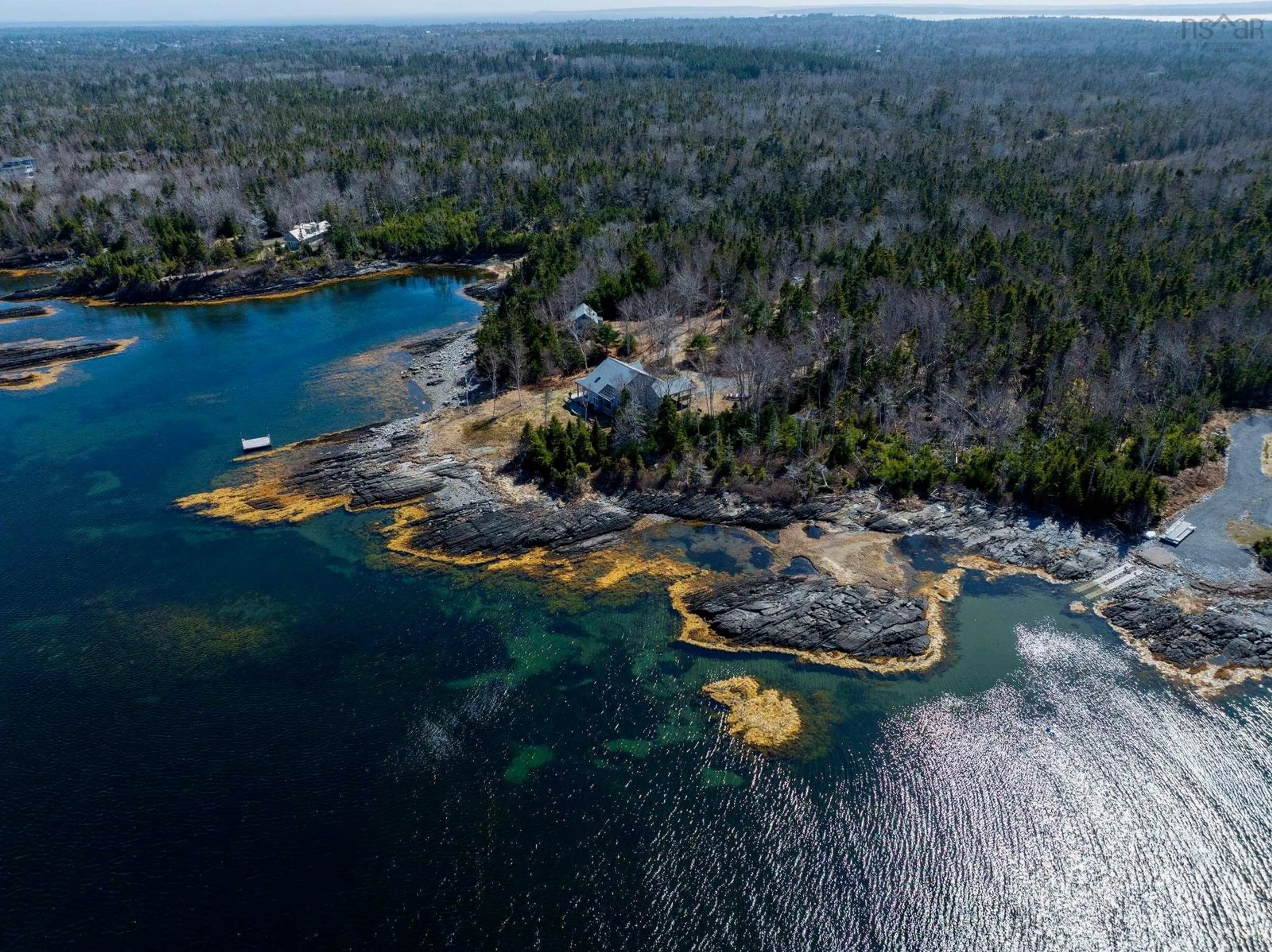 A pic from outside/outdoor area/front of a property/back of a property/a pic from drone, water/lake/river/ocean view for 139 Pine Dr, Heckmans Island Nova Scotia B0J 2C0