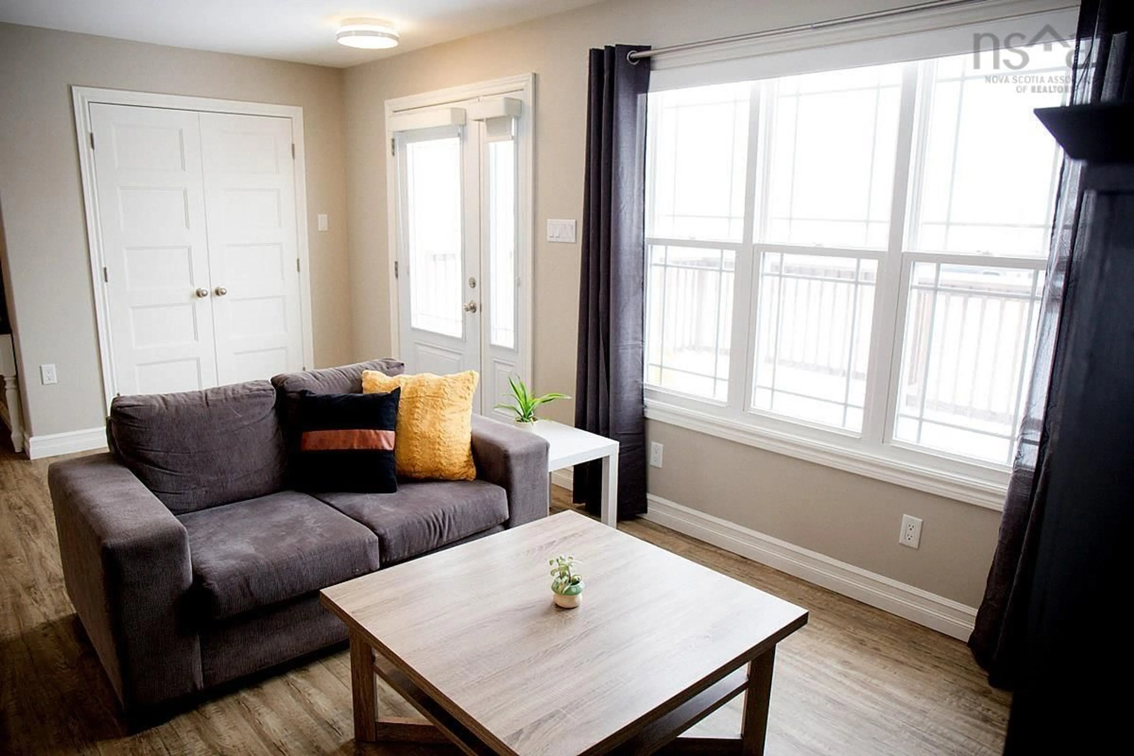 Living room with furniture, wood/laminate floor for 84 Forest St, Inverness Nova Scotia B0E 1N0