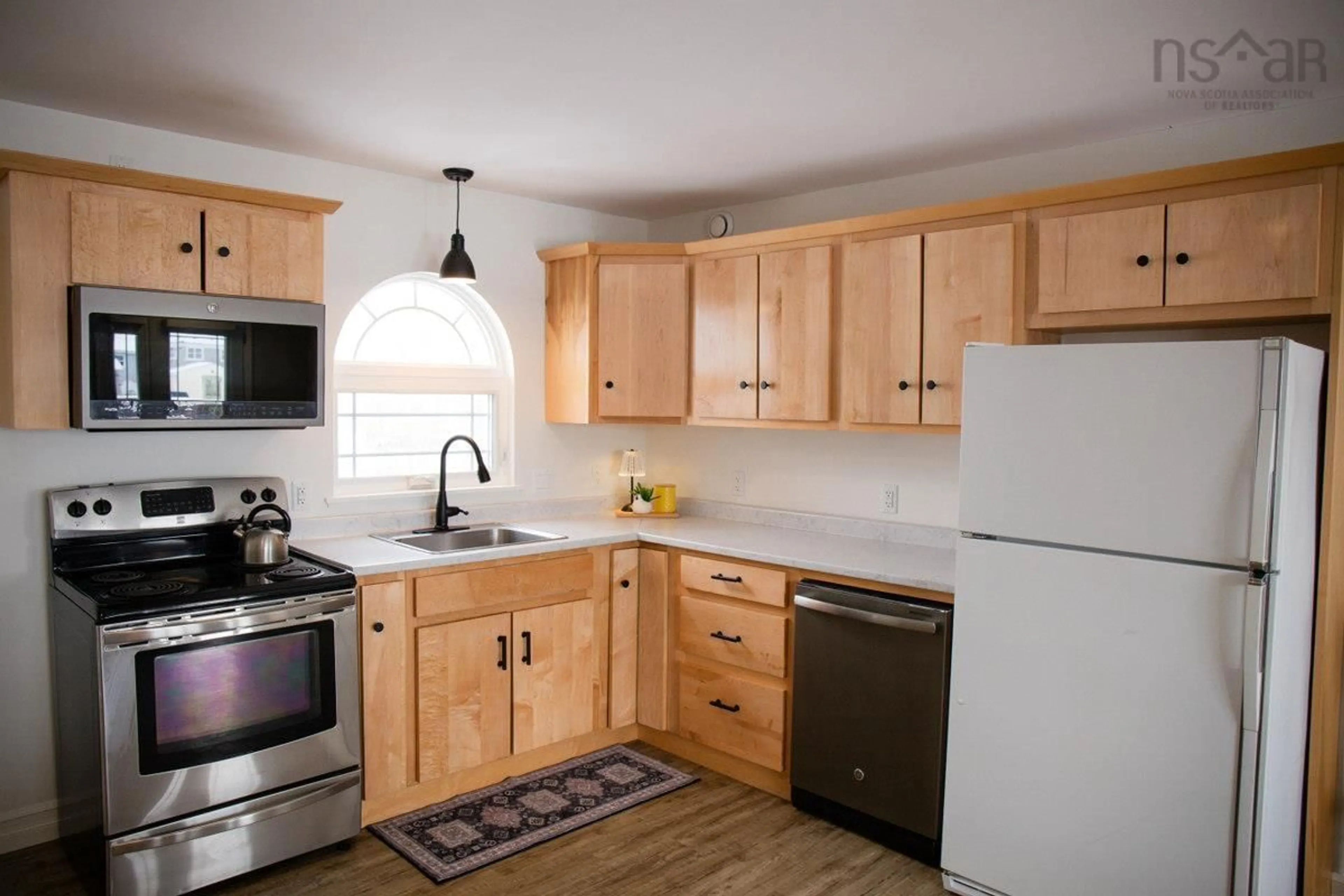 Standard kitchen, wood/laminate floor for 84 Forest St, Inverness Nova Scotia B0E 1N0