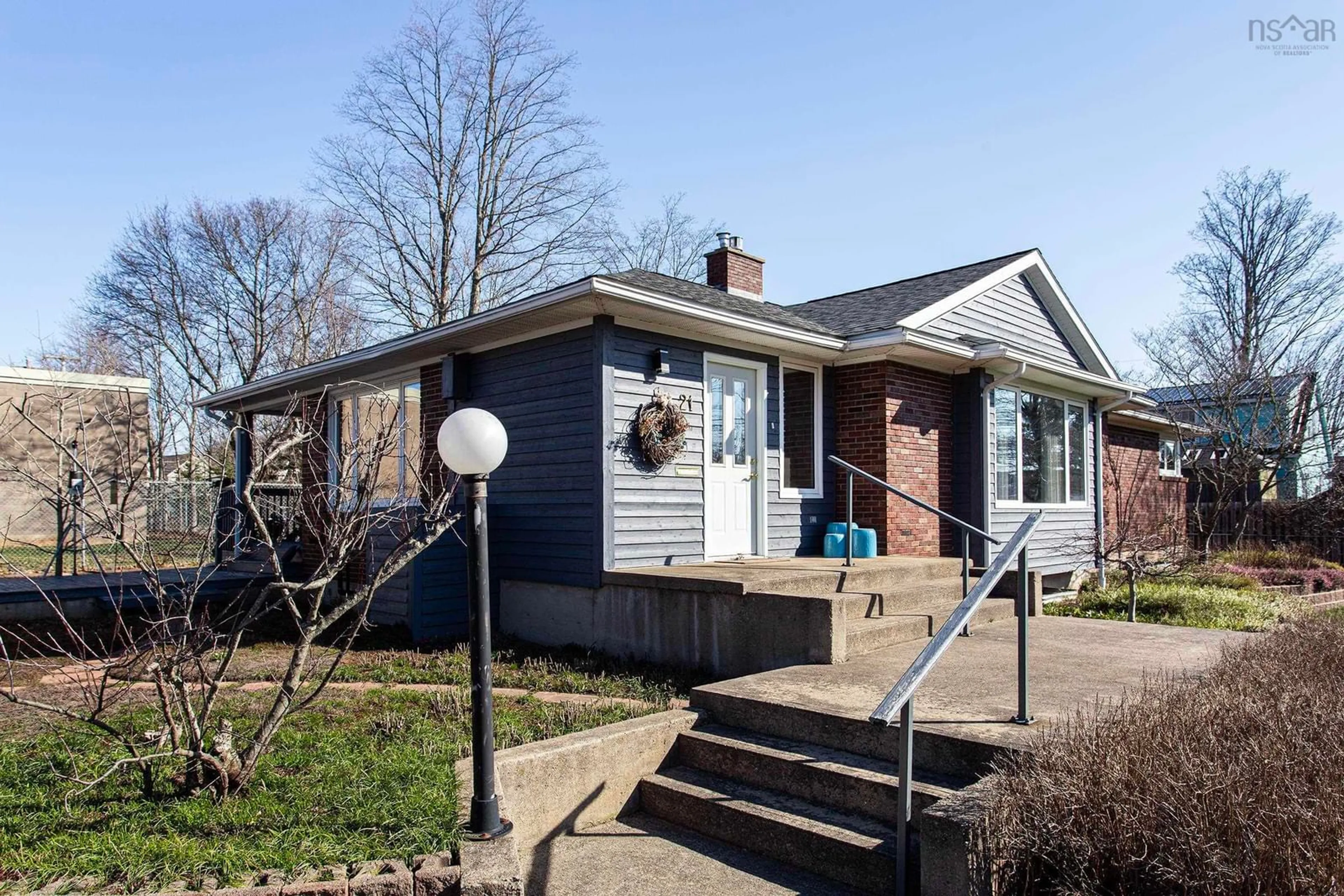 Home with brick exterior material, street for 21 Spring Garden Rd, Middleton Nova Scotia B0S 1P0