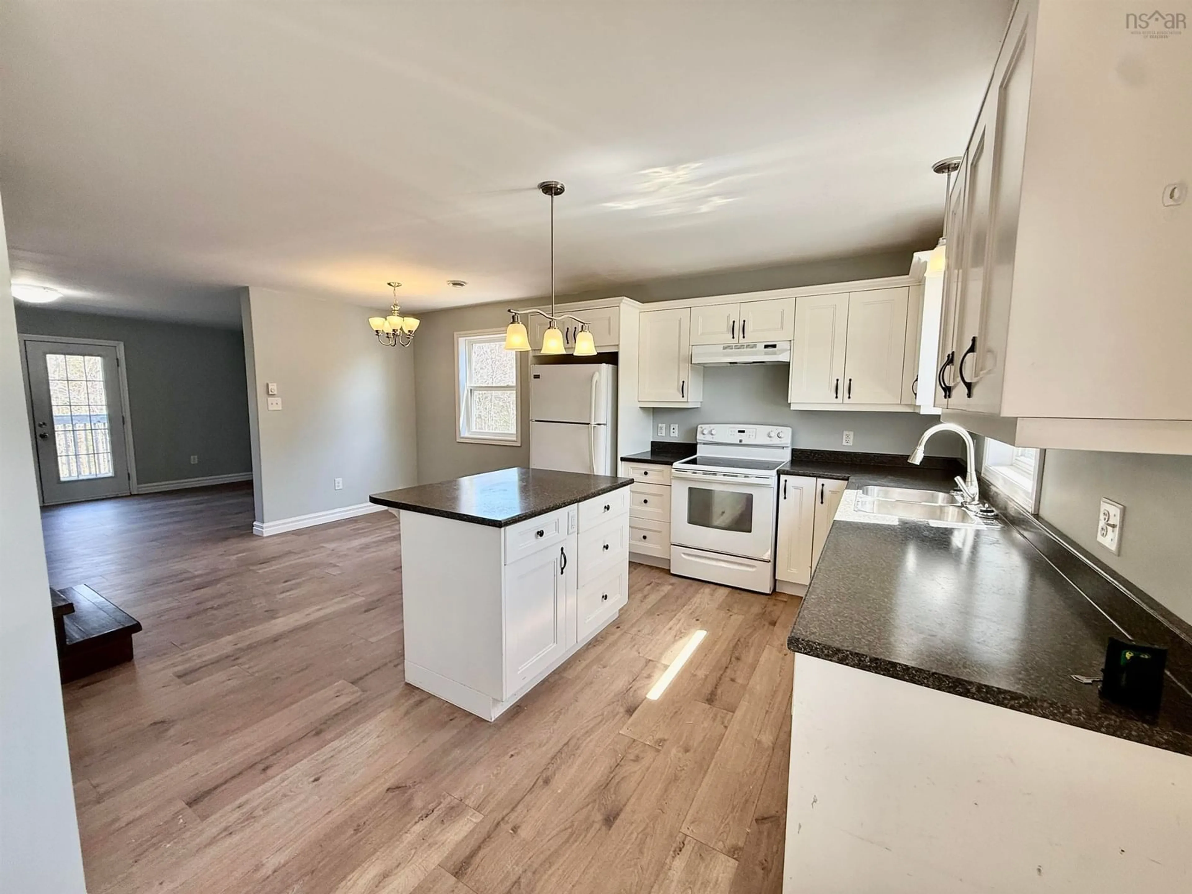 Open concept kitchen, wood/laminate floor for 719 Pleasant St, Dartmouth Nova Scotia B2W 1A8