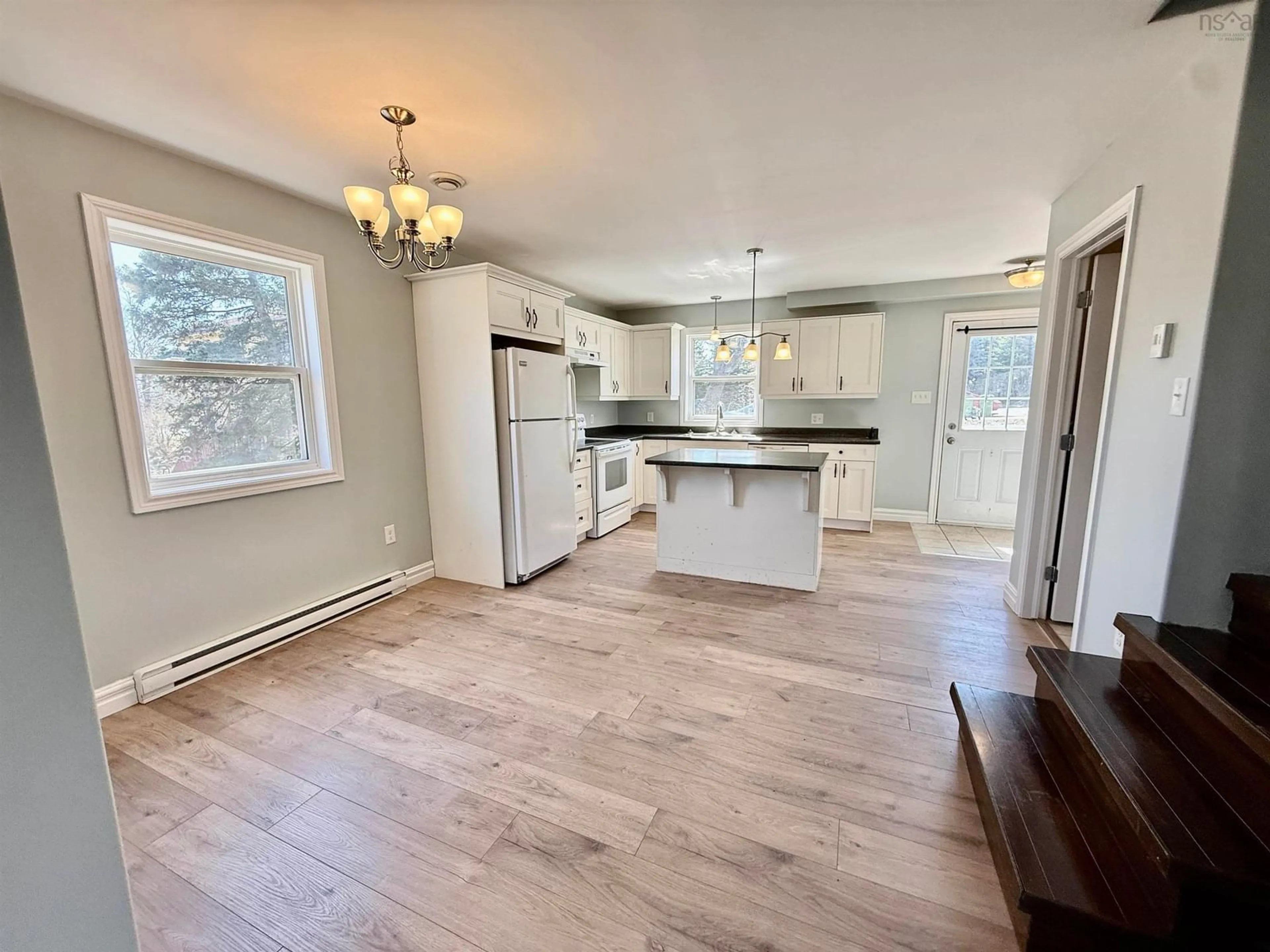 Open concept kitchen, wood/laminate floor for 719 Pleasant St, Dartmouth Nova Scotia B2W 1A8