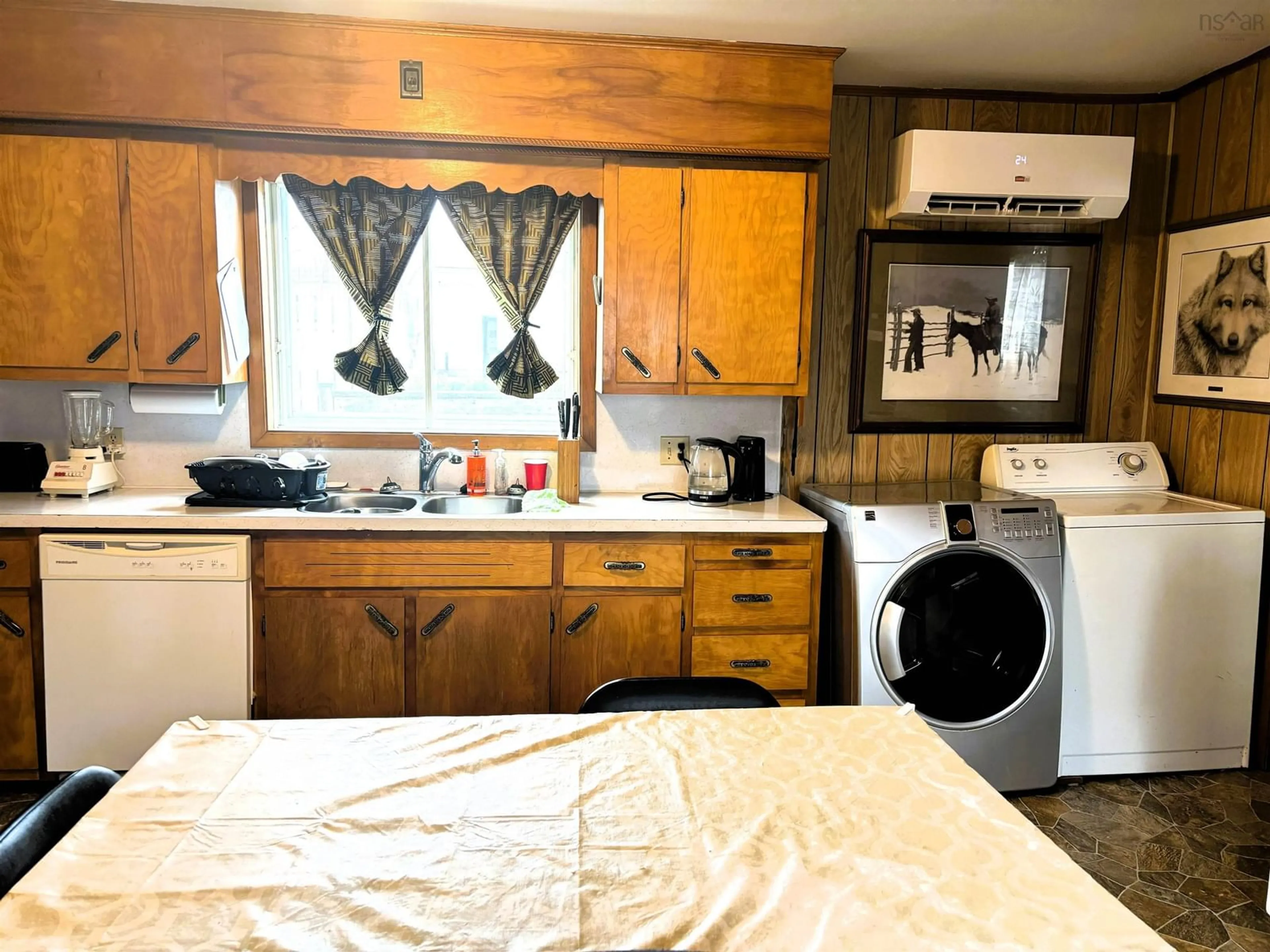 Kitchen with laundary machines, unknown for 49 Chapel St, Parrsboro Nova Scotia B0M 1S0