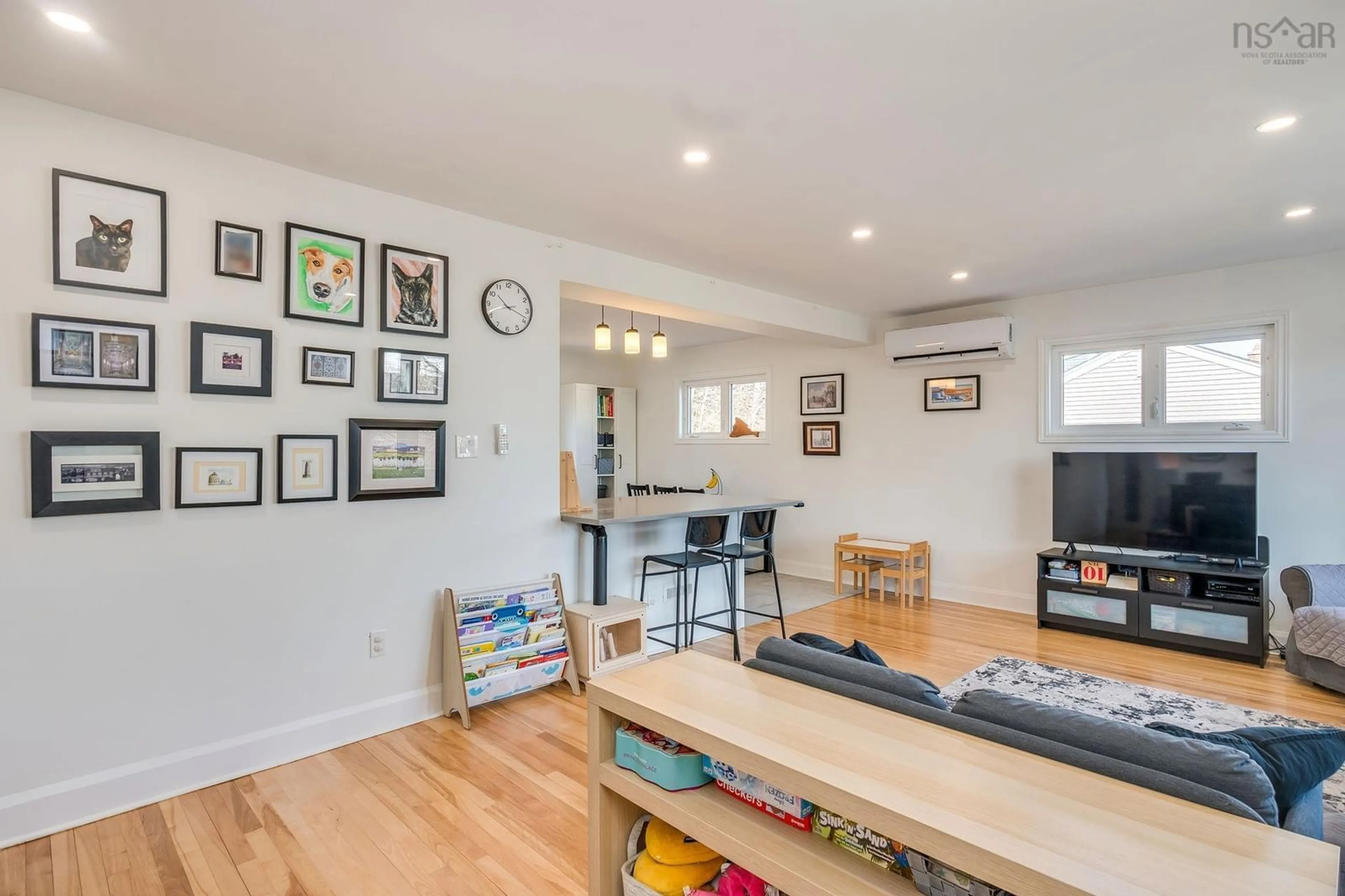 Living room with furniture, wood/laminate floor for 3160 Veith St, North End Nova Scotia B3K 3G8