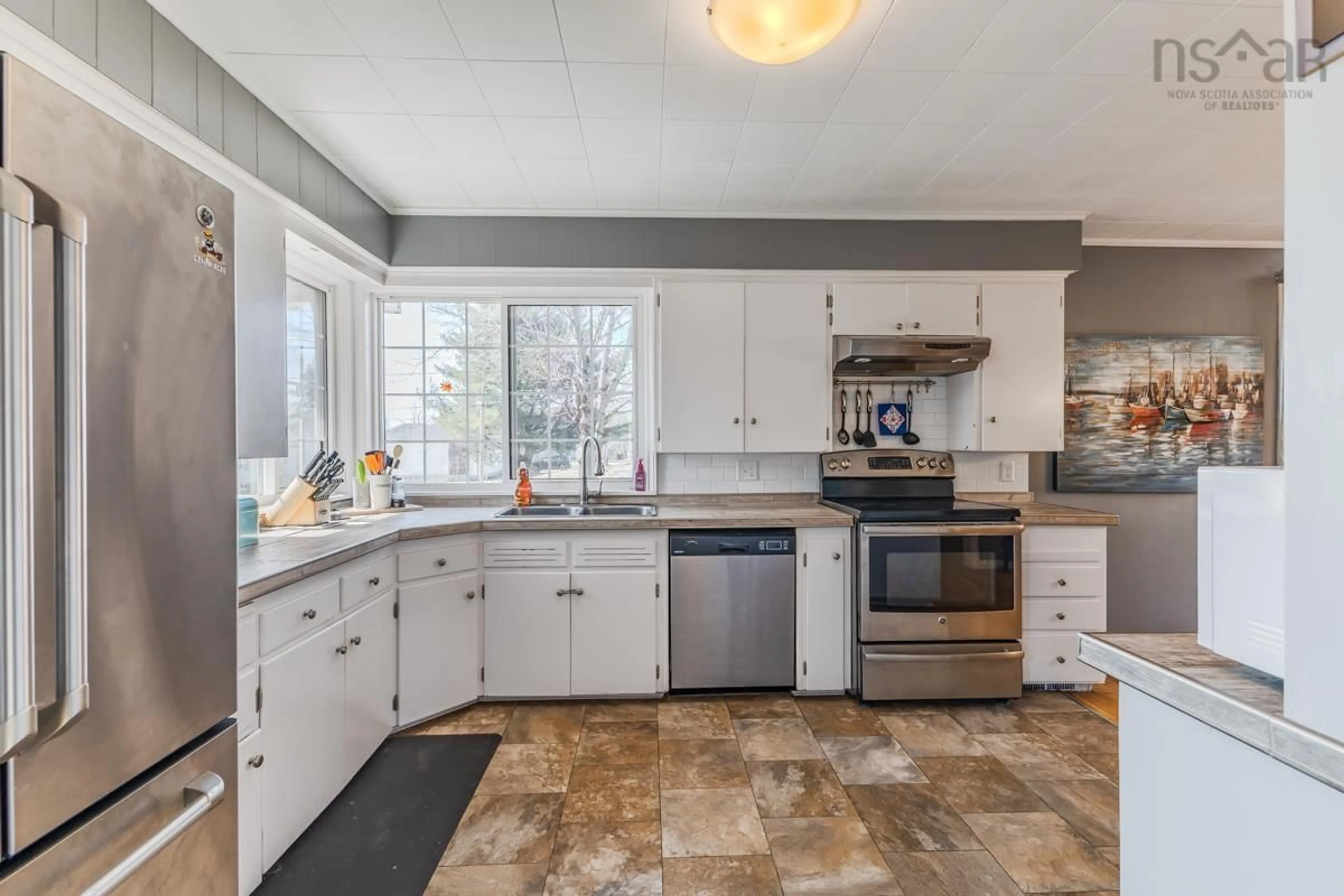 Open concept kitchen, ceramic/tile floor for 56 Regent St, Amherst Nova Scotia B4H 3T1
