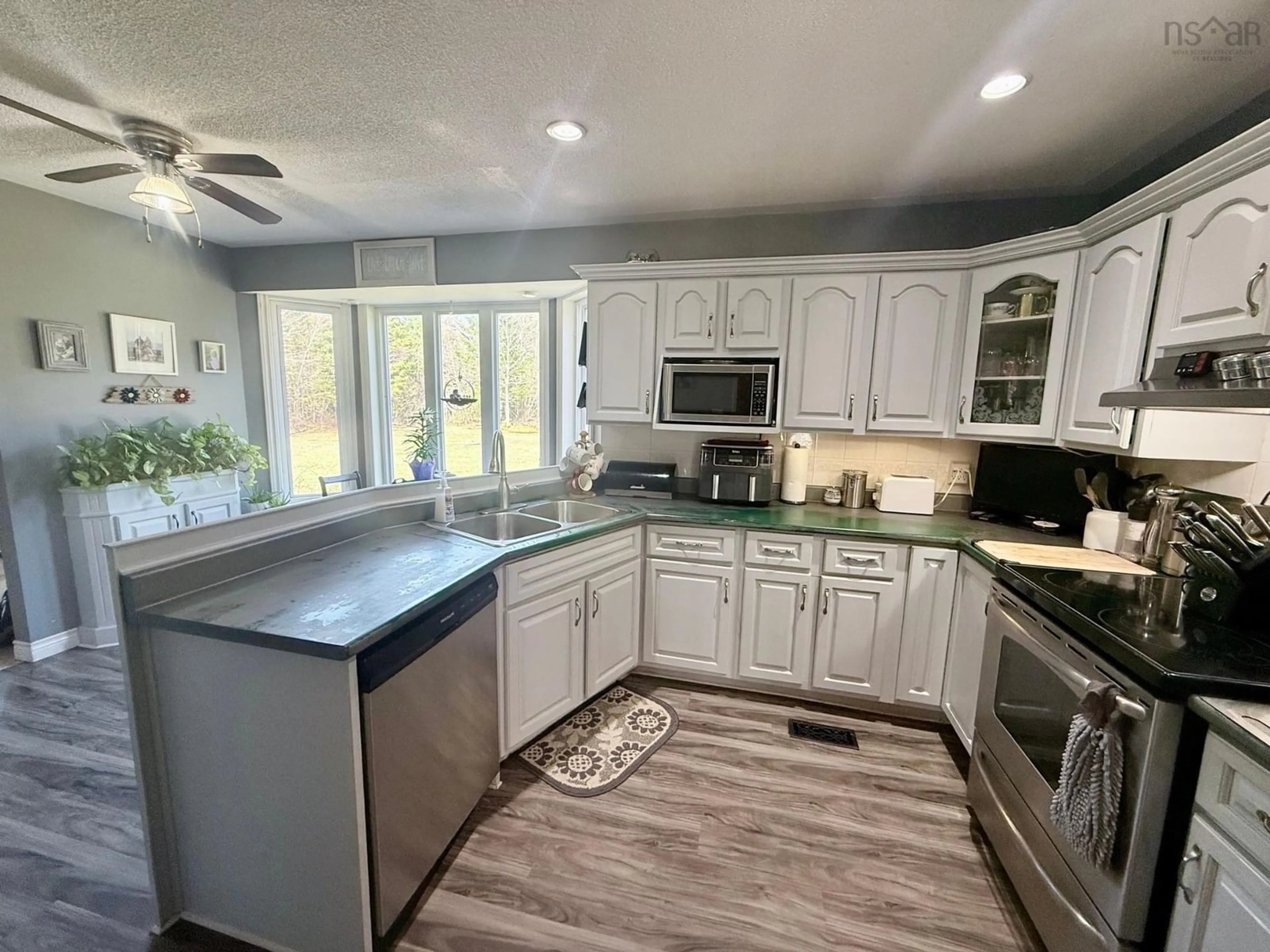 Open concept kitchen, ceramic/tile floor for 7514 Highway 3, Ste. Anne Du Ruisseau Nova Scotia B0W 2X0